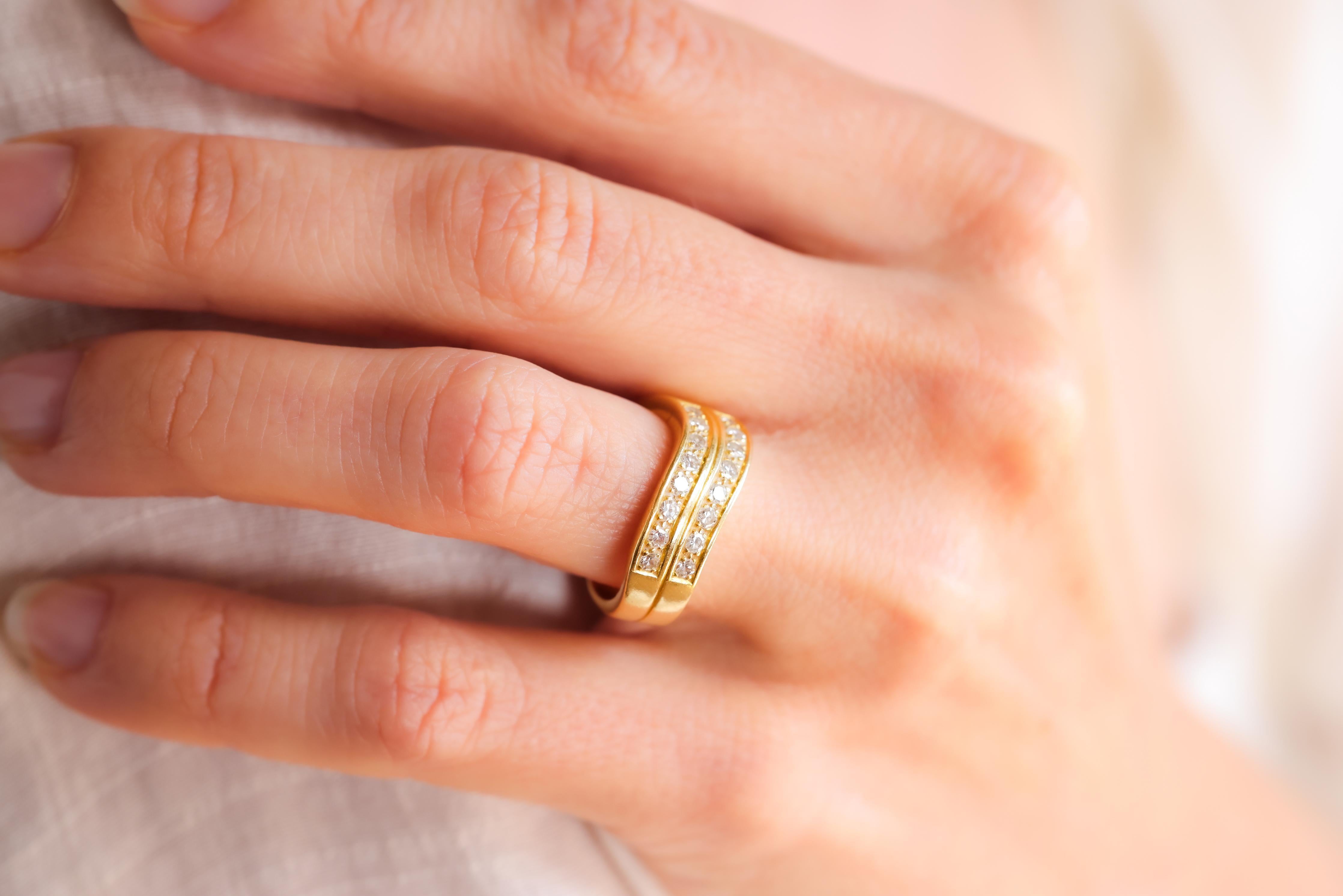 Center Stone: 16 Diamonds
Cut: Single
Weight: Approximately 0.35 Carats
Color: F-G
Clarity: SI
Metal: 18K Yellow Gold
Era: Vintage
Circa: 1990s
Hallmarks: 750 Purity Mark and Makers Marks
Size: 5 1/4 and can be resized
Gram weight: 6.22

This