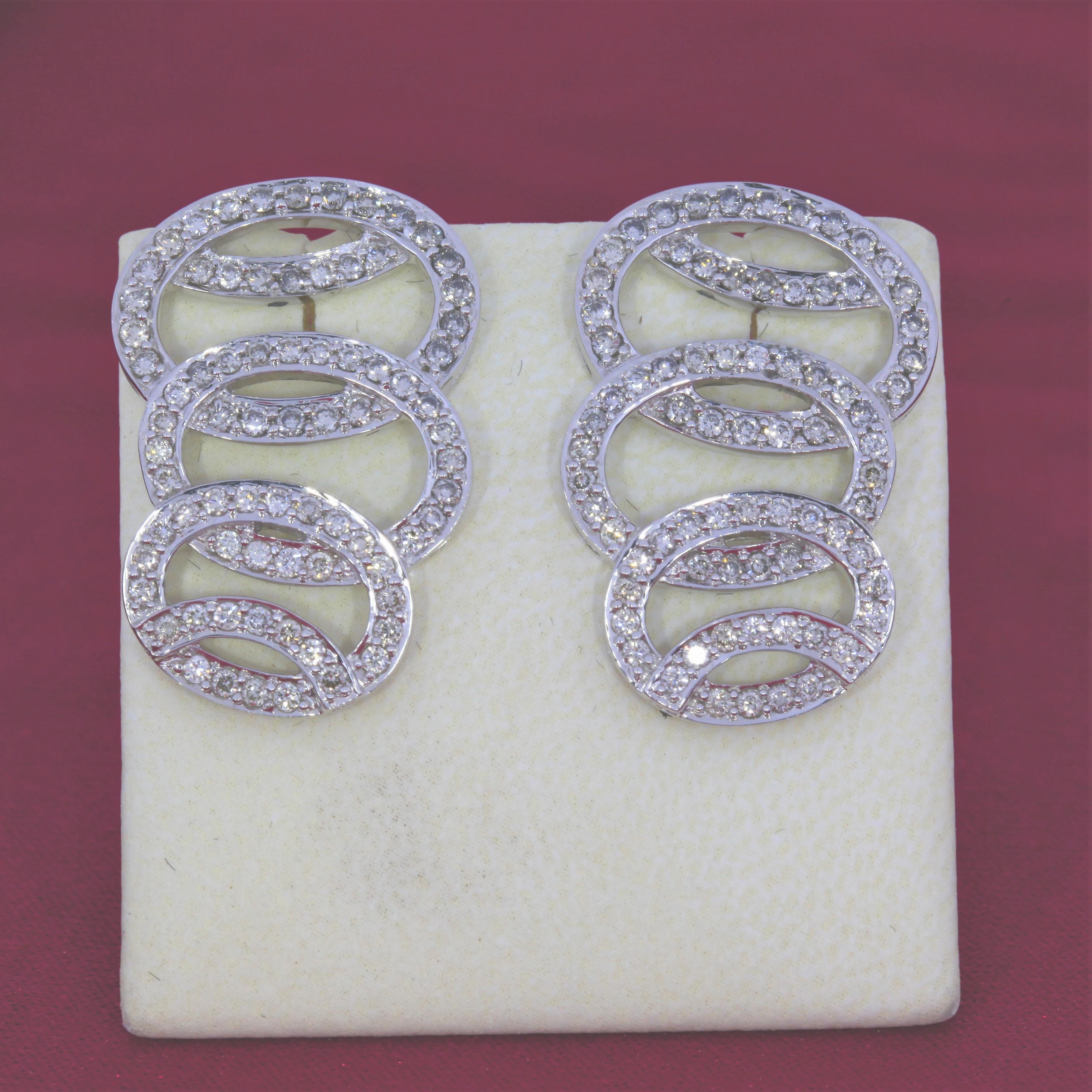 These vintage 14 karat white gold earrings prominently feature G-H VS Quality diamonds.