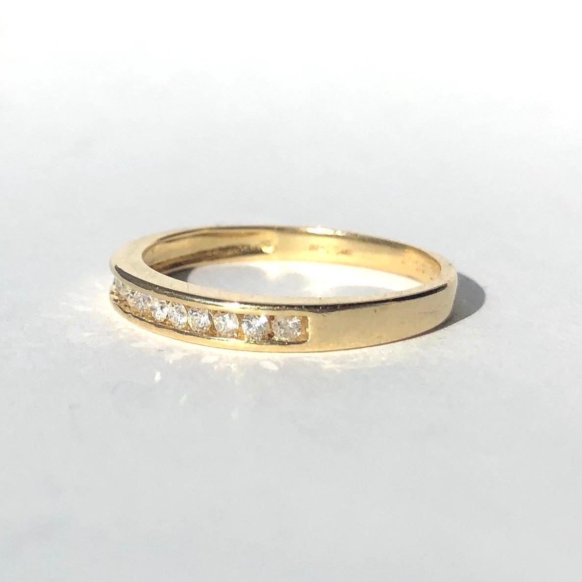 Each diamond in this simple and stylish band measure 3pts. There are 11 diamonds in total and they are wonderfully bright and have a great sparkle. The diamonds are set within an 18ct gold band. 

Ring Size: M or 6 1/4
Band Width: 2.5mm

Weight:
