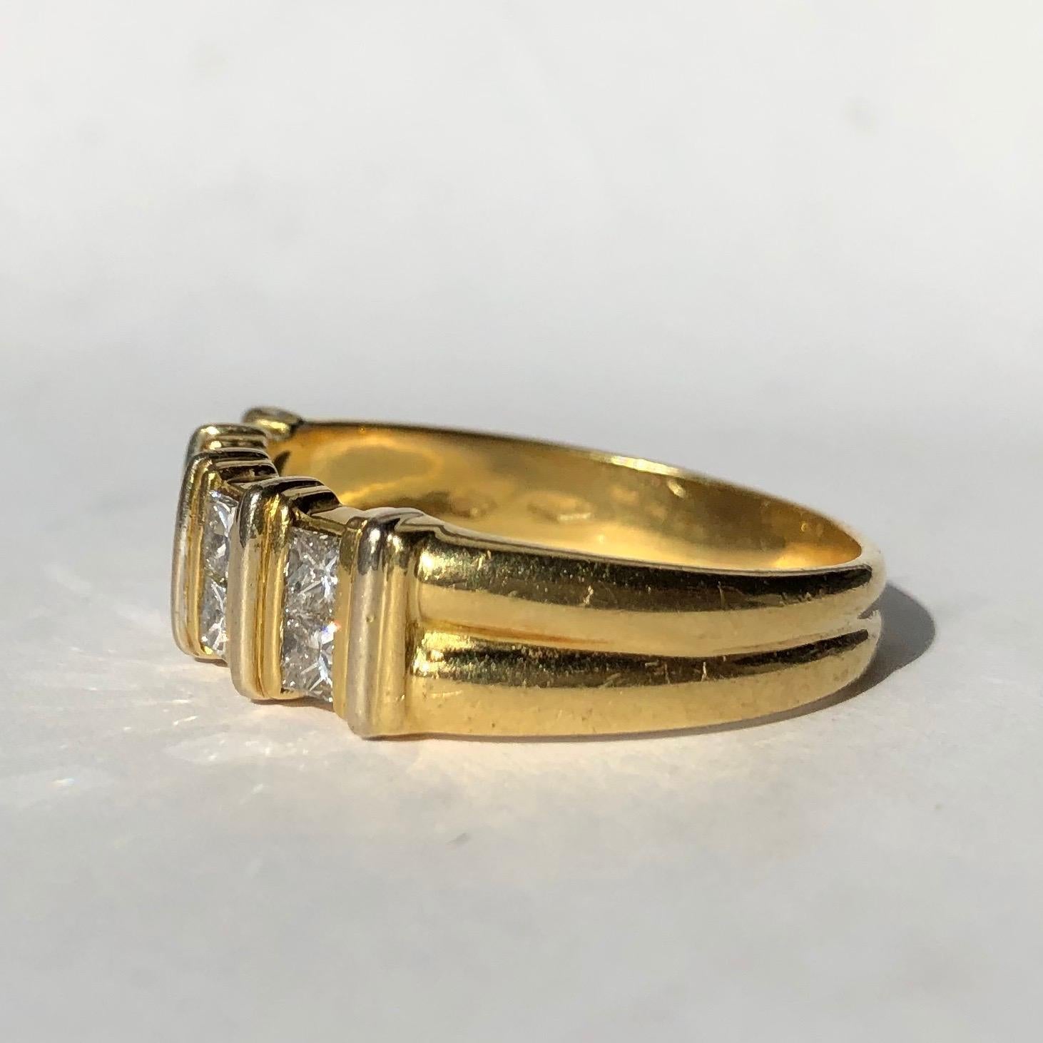 This gorgeous chunky gold band holds a total of eight great sized princess cut diamonds. Each diamond measures 10pts and have the most fabulous sparkle. Made in London, England.

Ring Size: Z+3 or 13 3/4
Band Width: 7.5mm 

Weight: 10.38g