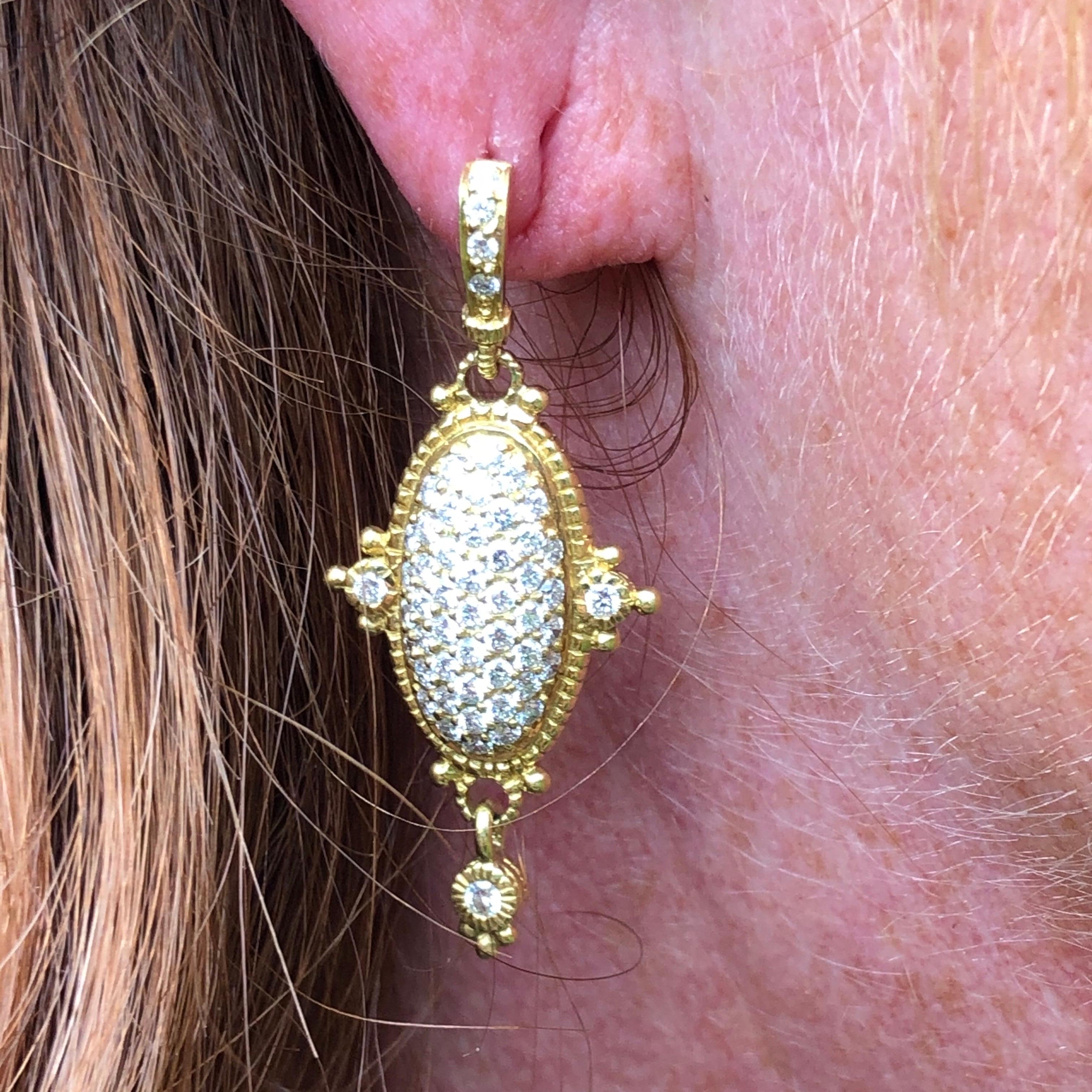 These delightful diamond encrusted Judith Ripka earrings hold so much sparkle and shine and the stones total 2ct.  The style has almost and Indian feel to them and the yellow gold is bright and glossy with so much detail. As well as the main panel