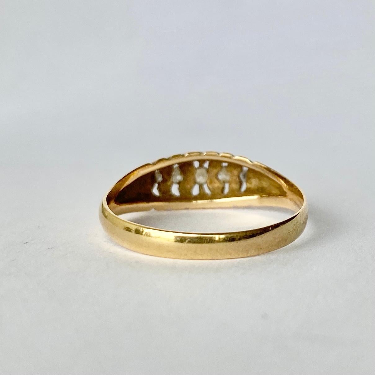 The boat shape setting in this ring holds a total of 5 diamonds totalling 20pts. The smooth band in which they sit is modelled in 18carat gold. Hallmarked Birmingham, 1971.

Ring Size: O 1/2 or 7 1/2
Band Width: 6mm

Weight: 2.38g