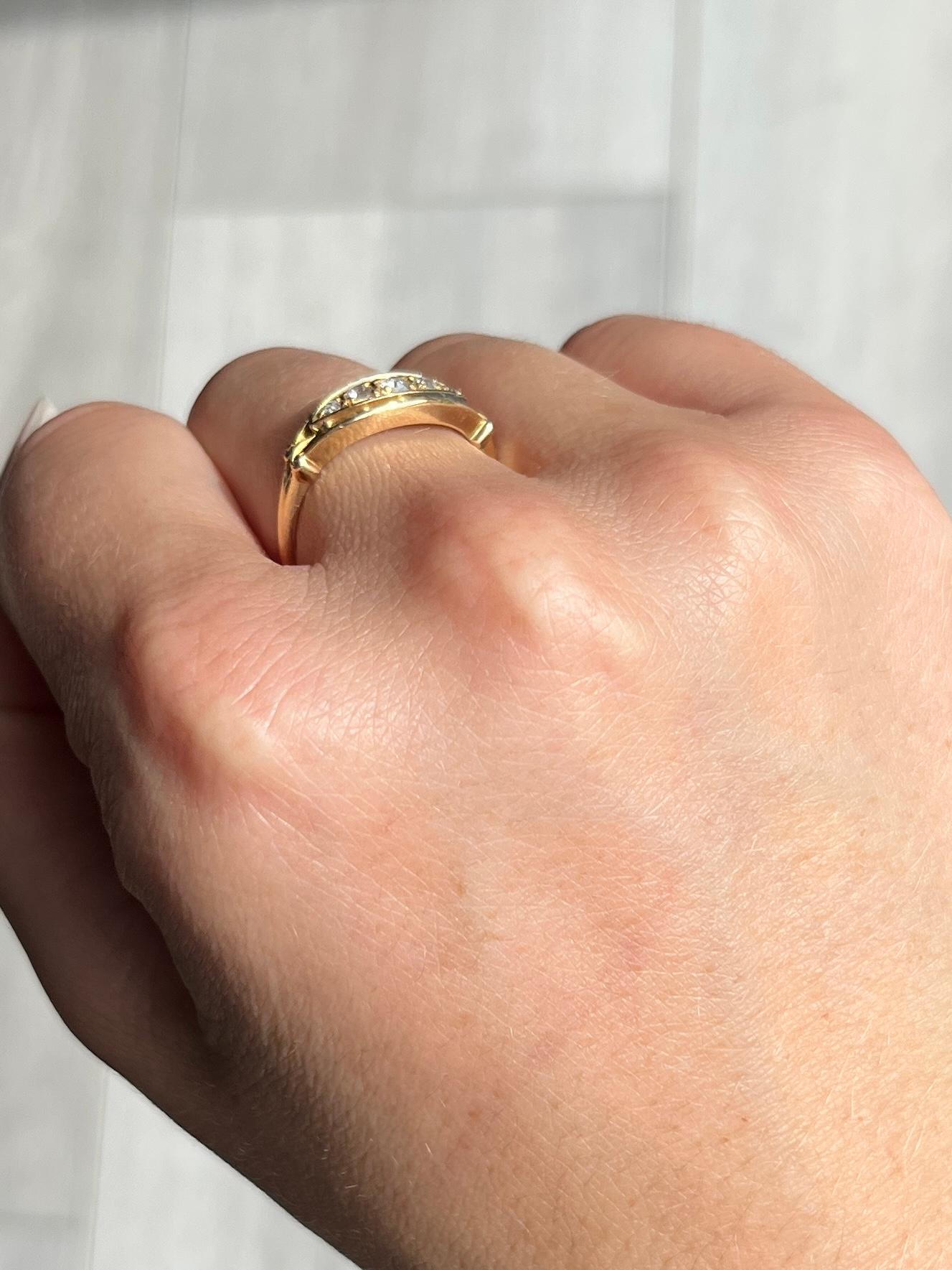 The boat shape setting in this ring holds a total of 5 diamonds measuring 7pts at the centre, 5pts and down to 3pts being the smallest size stone. Around the setting there is open work gold and the shoulders are split then carry on down to the plain