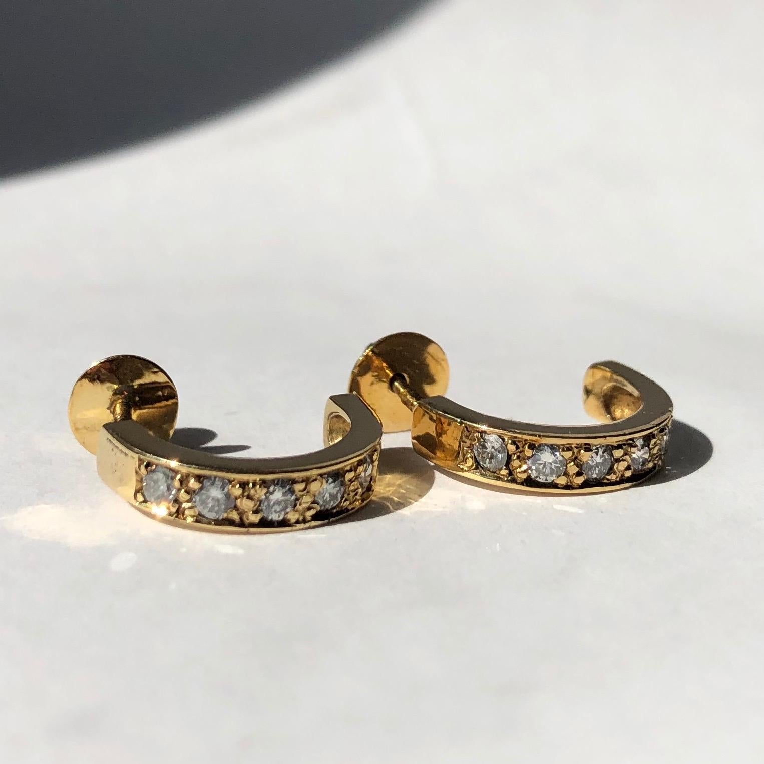 The old European cut diamonds have a wonderful sparkle and are set in 18ct yellow gold. The stones measure 25pts total per hoop and are set flush within the gold half hoop. The studs are screw back so are very secure. 

Hoop Width: 3mm 
Hoop
