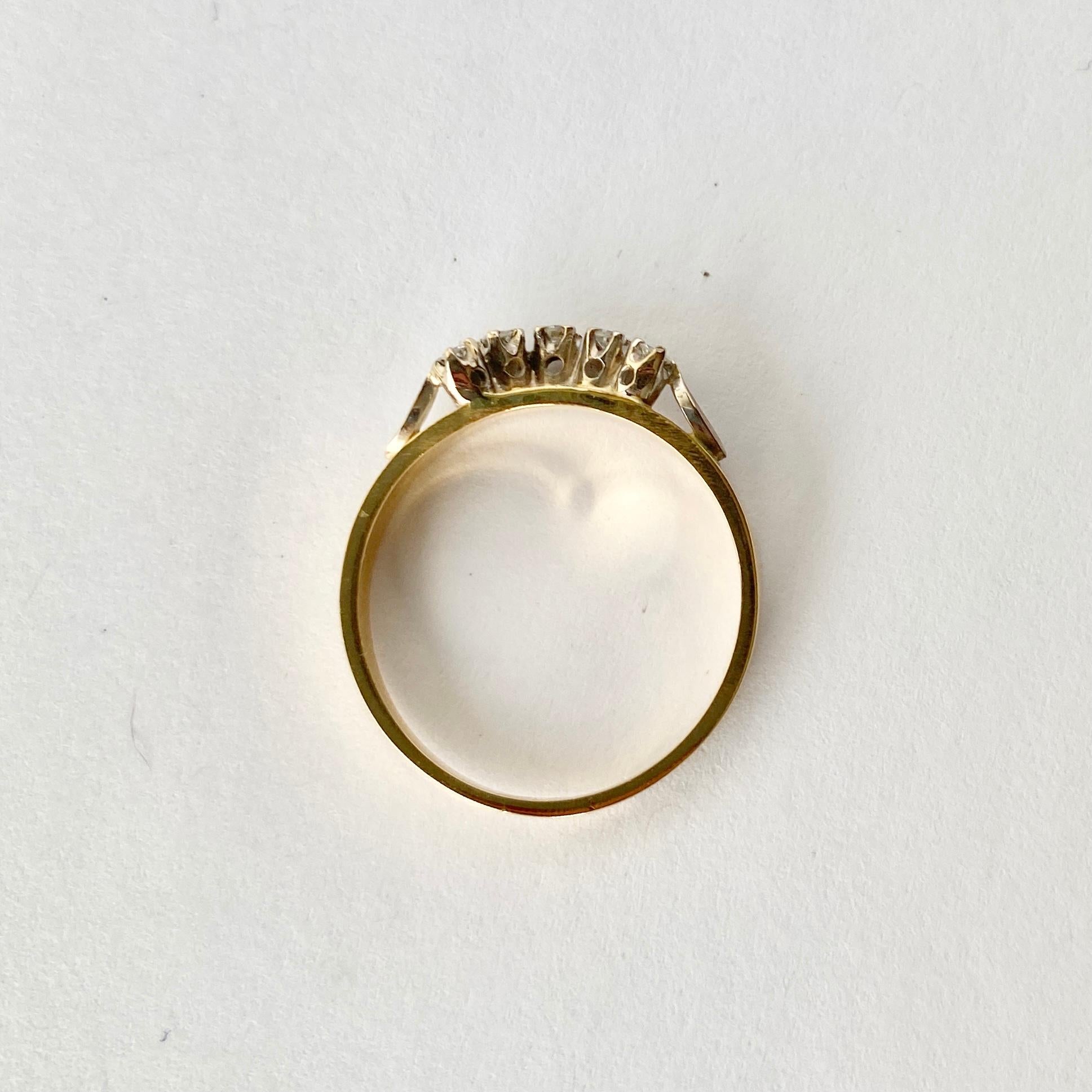 This 18carat gold band has a curved row of diamonds sitting on top which would perfectly hug a round faced ring or you could wear alone. The half halo of diamonds total 15pts.

Ring Size: P 1/2 or 8 
Band Width: 4mm

Width: 3.2g

