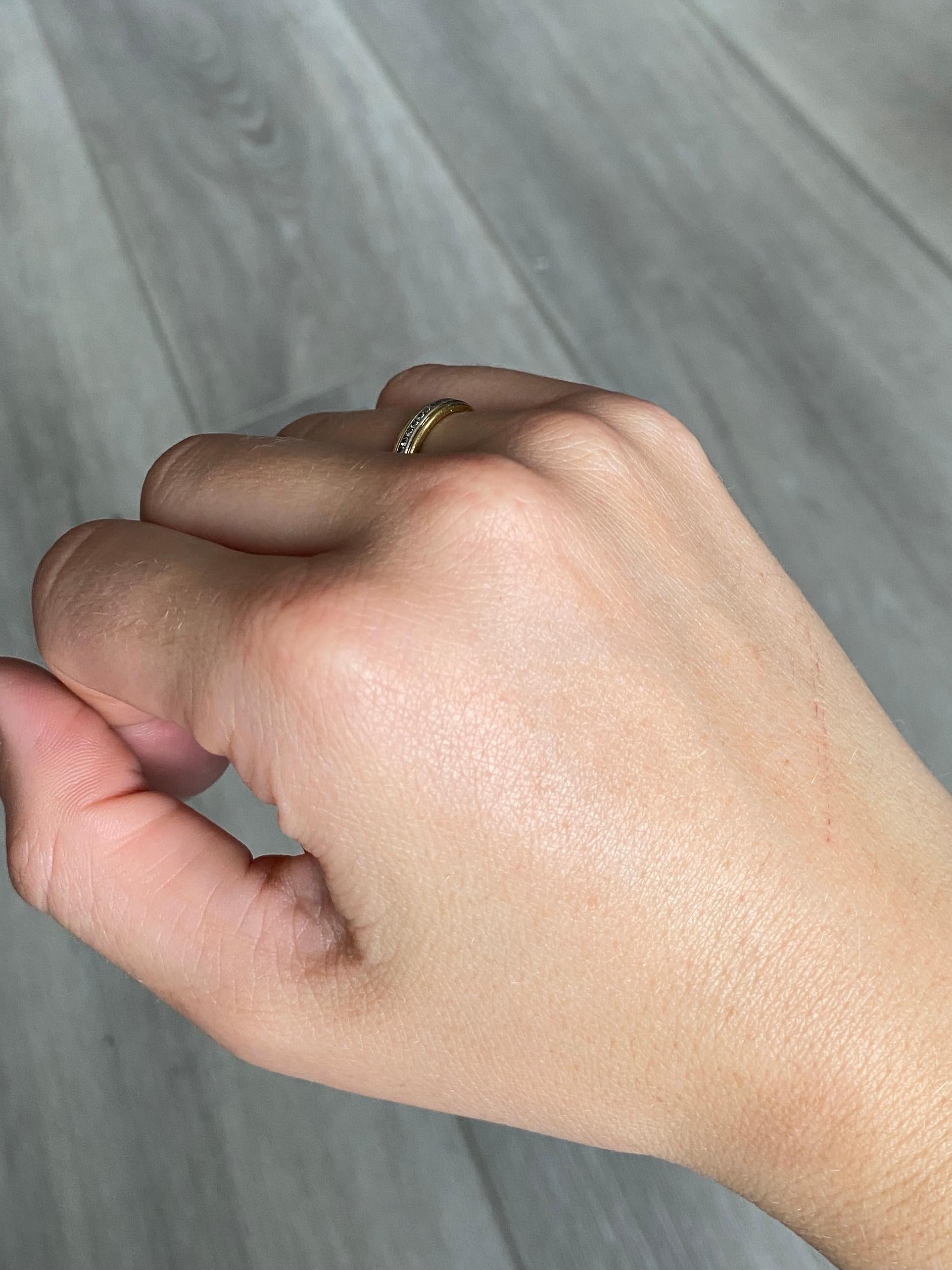 This half eternity band holds approx 20points worth of shimmering diamonds. The stones are set within the smooth 18ct white and yellow gold band. 

Ring Size: H 1/2 or 4 
Band Width: 3.5mm 

Weight: 2.6g