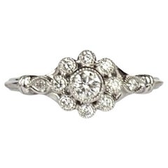 Anillo vintage de diamantes y racimo de margaritas en oro blanco de 18 quilates