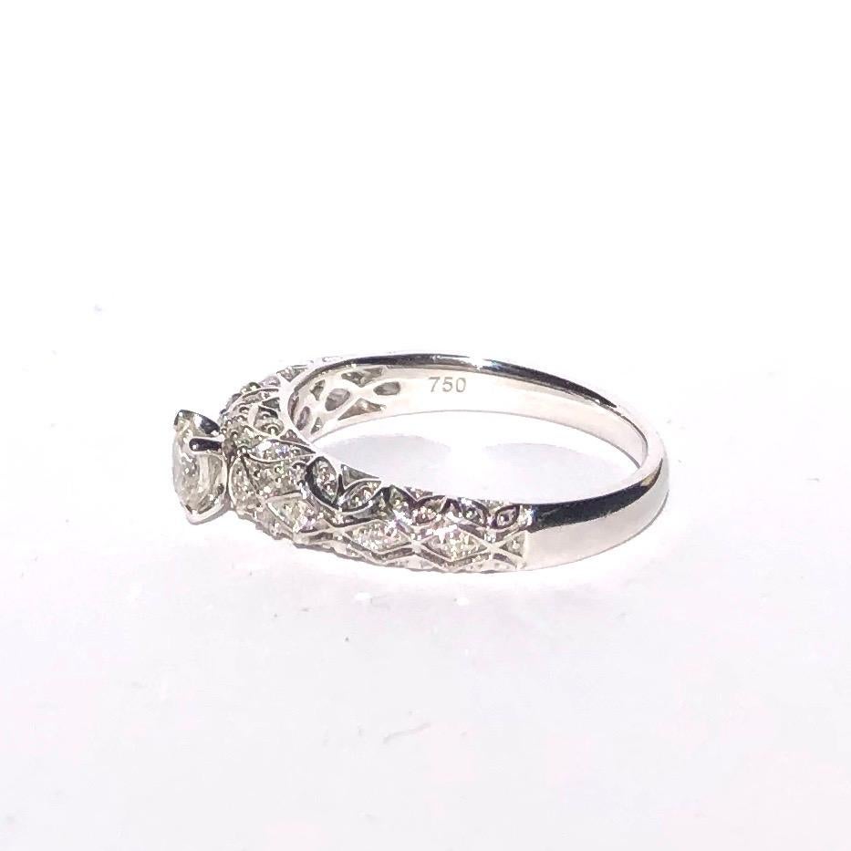 I think you will agree this solitaire is an absolute stunner! The central stone measures 35pts and is H colour S1 clarity. The gallery and shoulders are encrusted with diamonds and leaf style details. The central stone sits proud on the gorgeous
