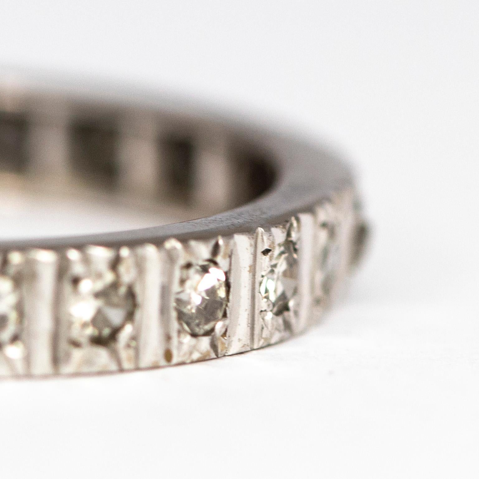 This fabulous diamond eternity band features diamonds all the way around the band. The 3pt diamonds are set in simple textured settings which sit flush in the band. 

Ring Size: S 1/2 or 9 1/2 
Band Width: 3mm 

Weight: 3.7grams 