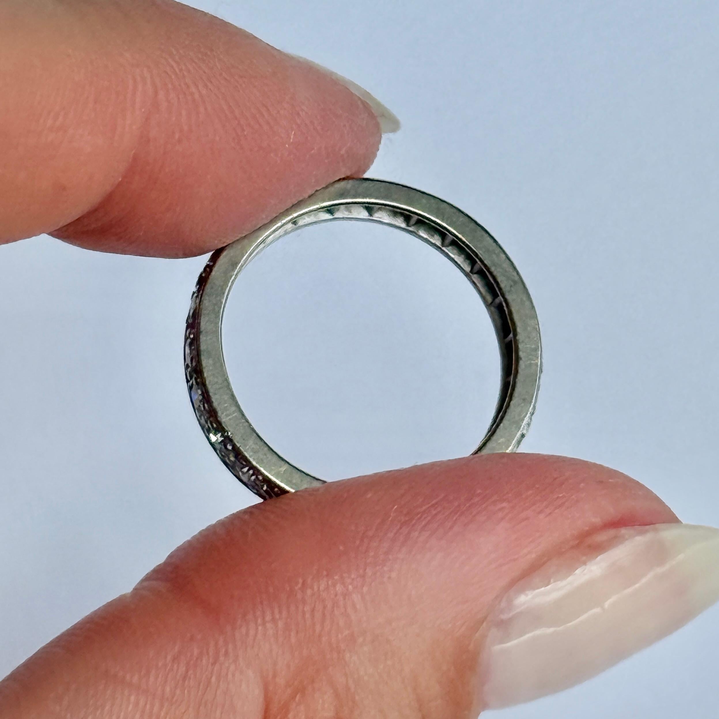 Sparkling full diamond eternity ring modelled out of 18ct white gold and Hallmarked London England 1975. Diamond total 50pts. 

Ring Size: L or 5 3/4 
Band Width: 3mm
Height Off Finger: 1.5mm

Weight: 3.3g