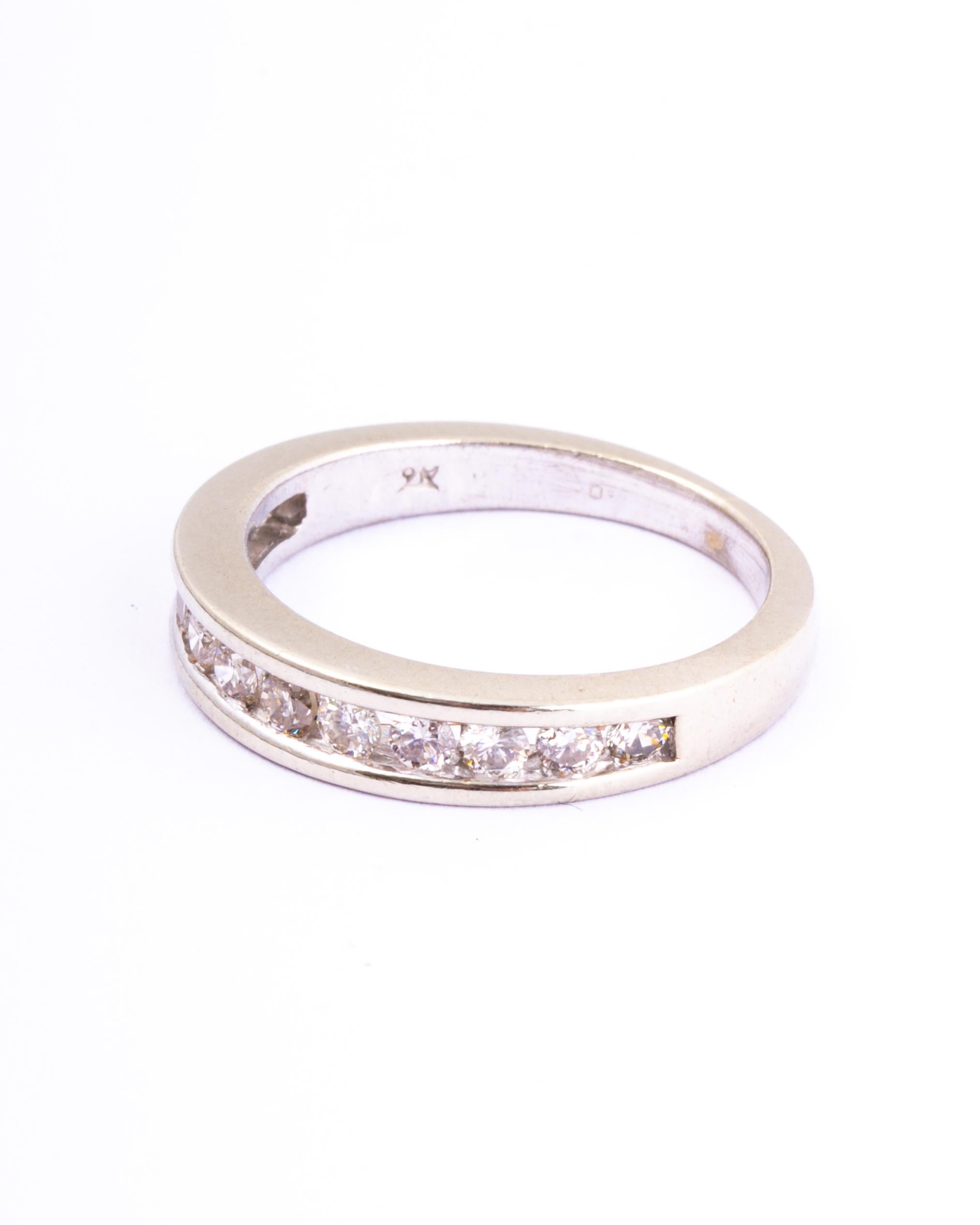 This half eternity band holds 50points worth of shimmering diamonds. The stones are set within the smooth 9ct white gold band. 

Ring Size: J 1/2 or 5 
Band Width: 4.5mm 

Weight: 2.6g