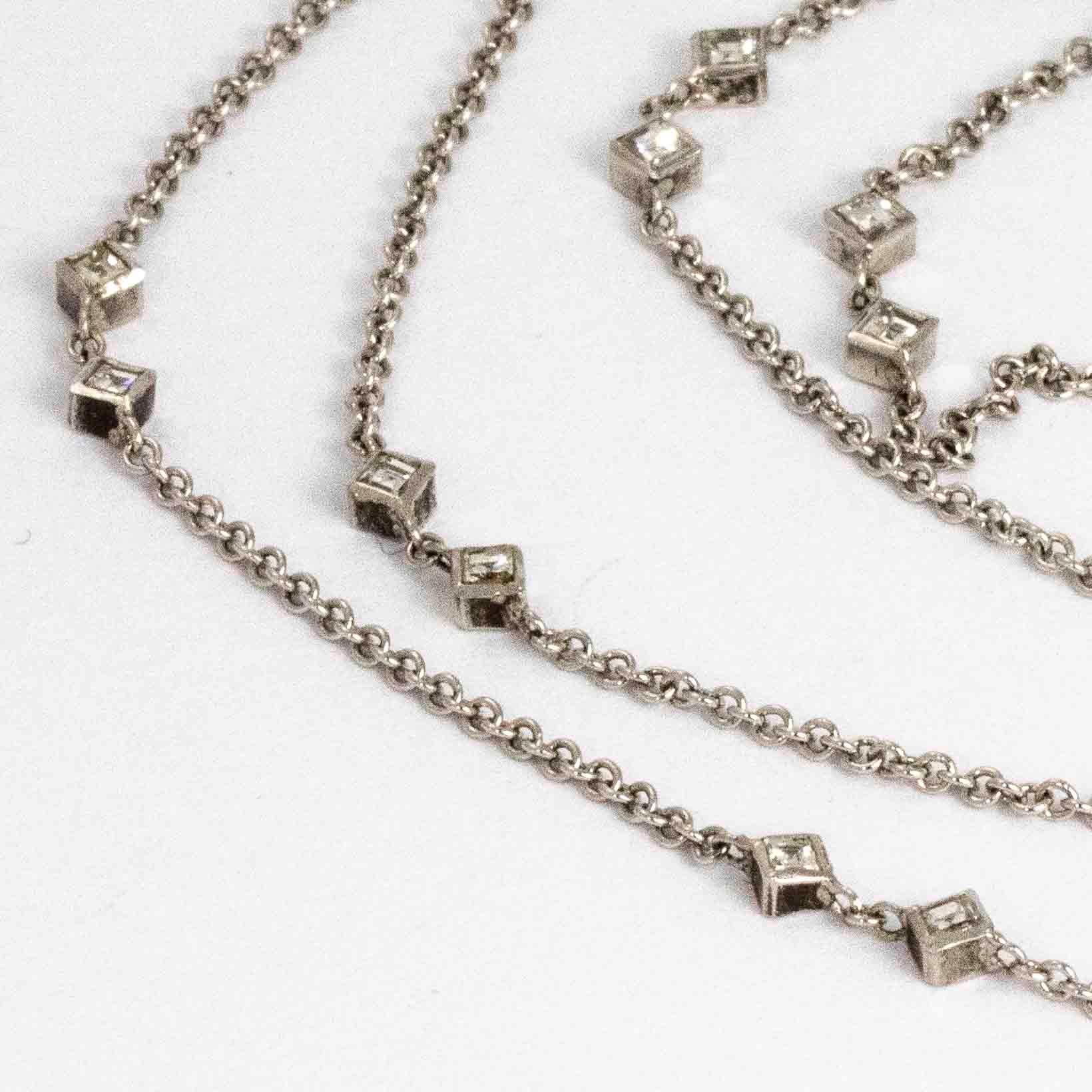 This stylish necklace holds pairs of tiny sparkling diamond points set in square settings. Modelled in 18ct gold and made in Italy.

Length: 60cm 