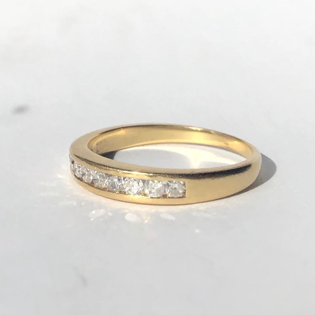 Nine bright sparkling diamonds lay flush within a gorgeous 9ct gold band. The Diamonds measure 4pts each. This ring would make a great stacking ring, a fancy wedding band or just a bit of sparkle to wear everyday!

Ring Size: N or 6 3/4 
Band Width: