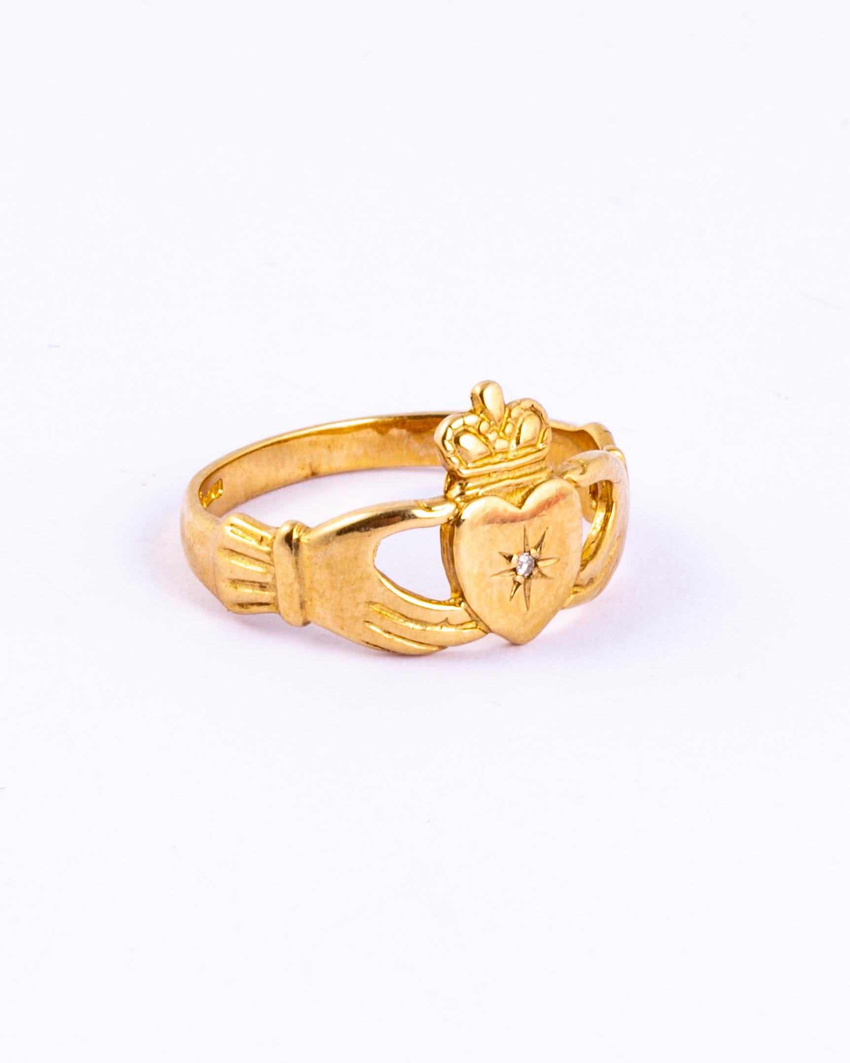 These claddagh rings are a traditional Irish ring which represents love, loyalty, and friendship. This one is set with a diamond point and modelled in 9ct gold. 

Ring Size: K 1/2 or 5 1/2 
Width: 11mm

Weight: 2g