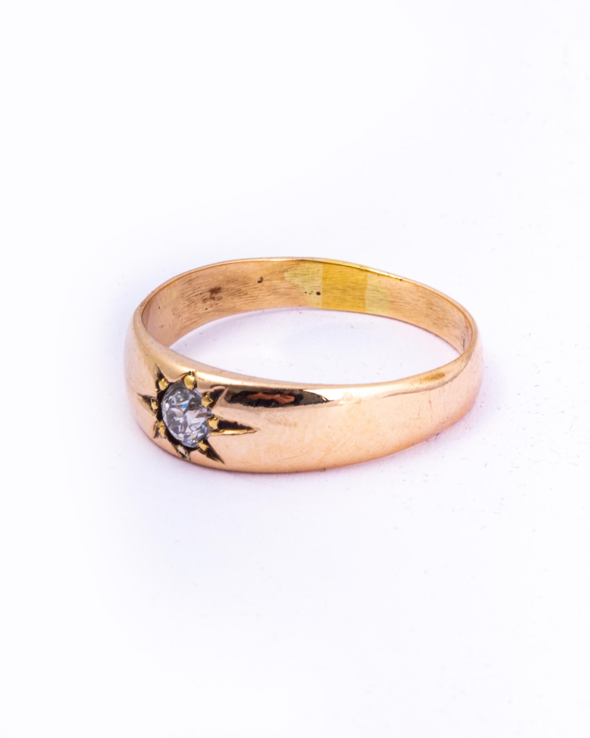 This gypsy band holds a 25pt diamond which is bright, white and has a stunning sparkle. the stone is set in a star setting and the band is modelled in 9ct gold. 

Ring Size: O 1/2 ot 7 1/2 
Band Width: 5.5mm

Weight: 2.9g