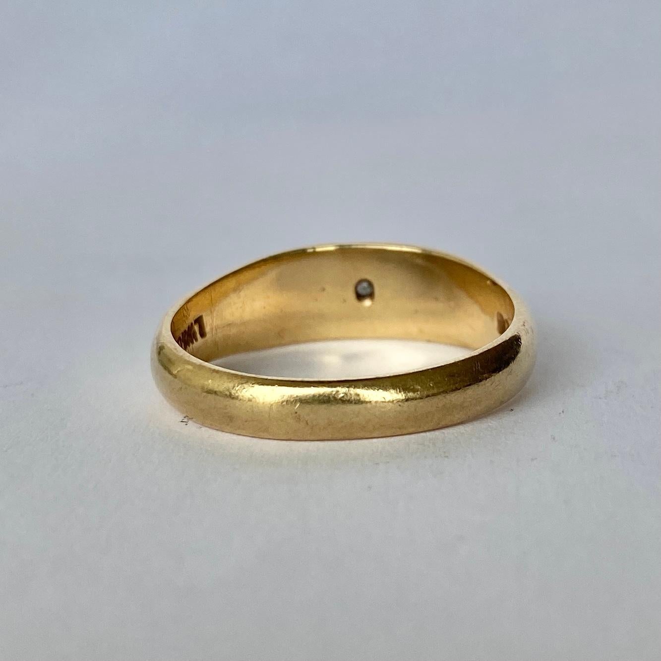 The lovely diamond in this simple band measures 10pts and adds a wonderful amount of sparkle to what would be a simple gold band. Modelled in 9 Carat gold. hallmarked London. 

Ring Size:U or 10
Band Width: 6mm

Weight: 5.99g