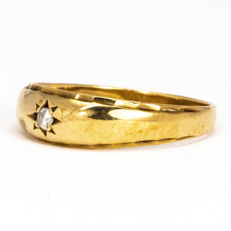 The stone set in this chunky glossy gold ring is 10pts and gives the perfect amount o sparkle to his simple design. Modelled in 9ct gold. 

Ring Size: Y or 12
Band Width: 6.5mm