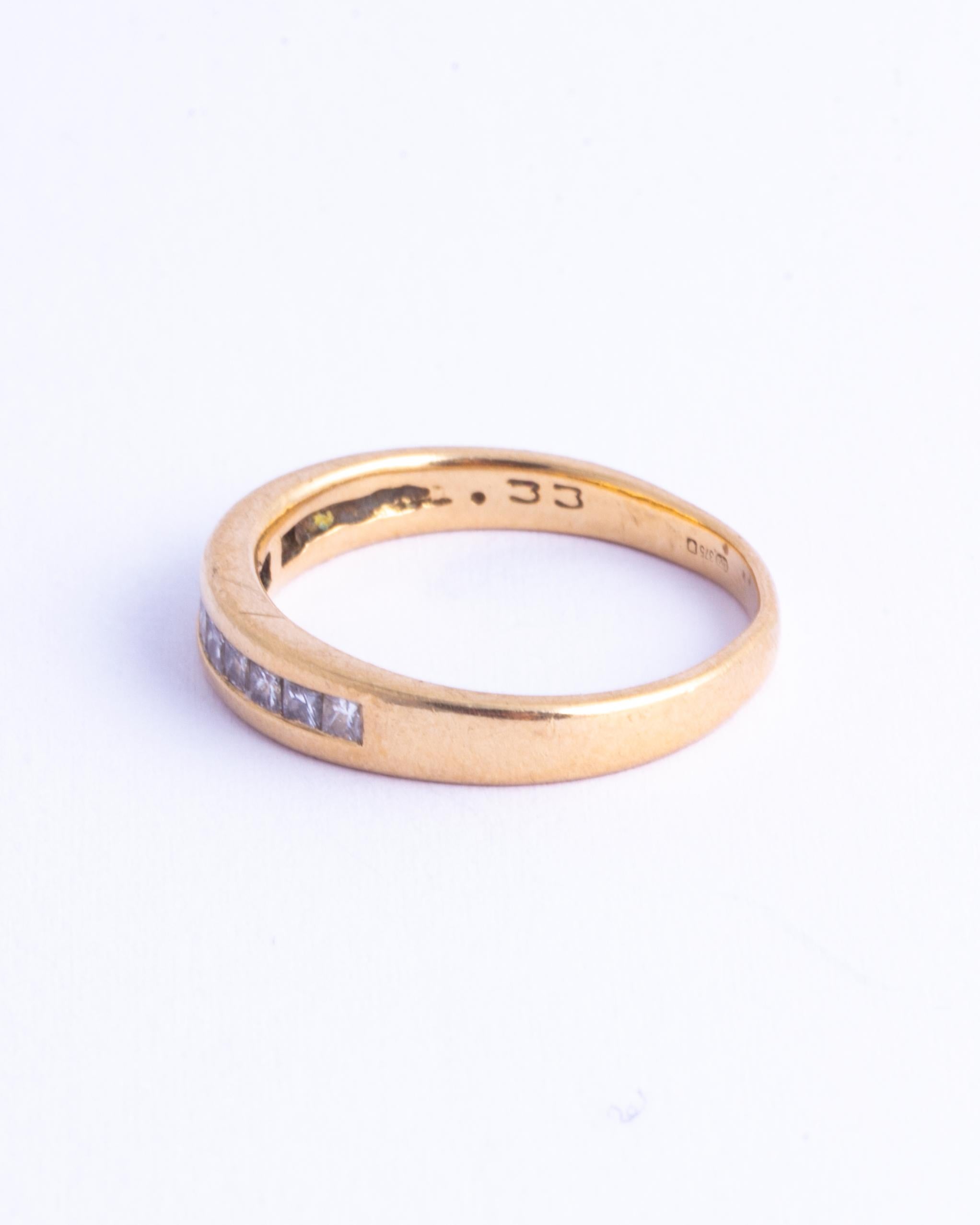 The diamonds set within this 9ct gold band are princess cut and total approx 50pts. They have a great shimmer to them and are bright stones. Made in London, England. 

Ring Size: M or 6 1/4 
Band Width: 4mm 

Weight: 2.5g
