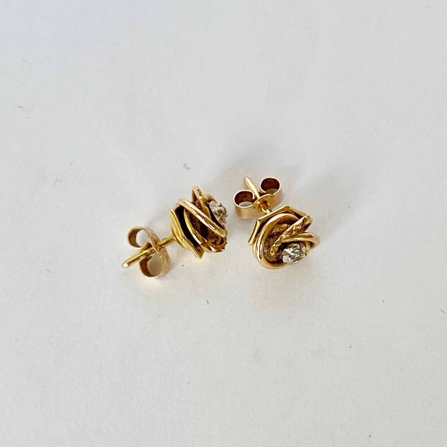 Glossy 9ct yellow gold superbly tied in a knot make the most stylish design for these earrings. At the centre of the knot is a diamond point set in an illusion setting. 

Knot Diameter: 8mm

Weight: 1.67g