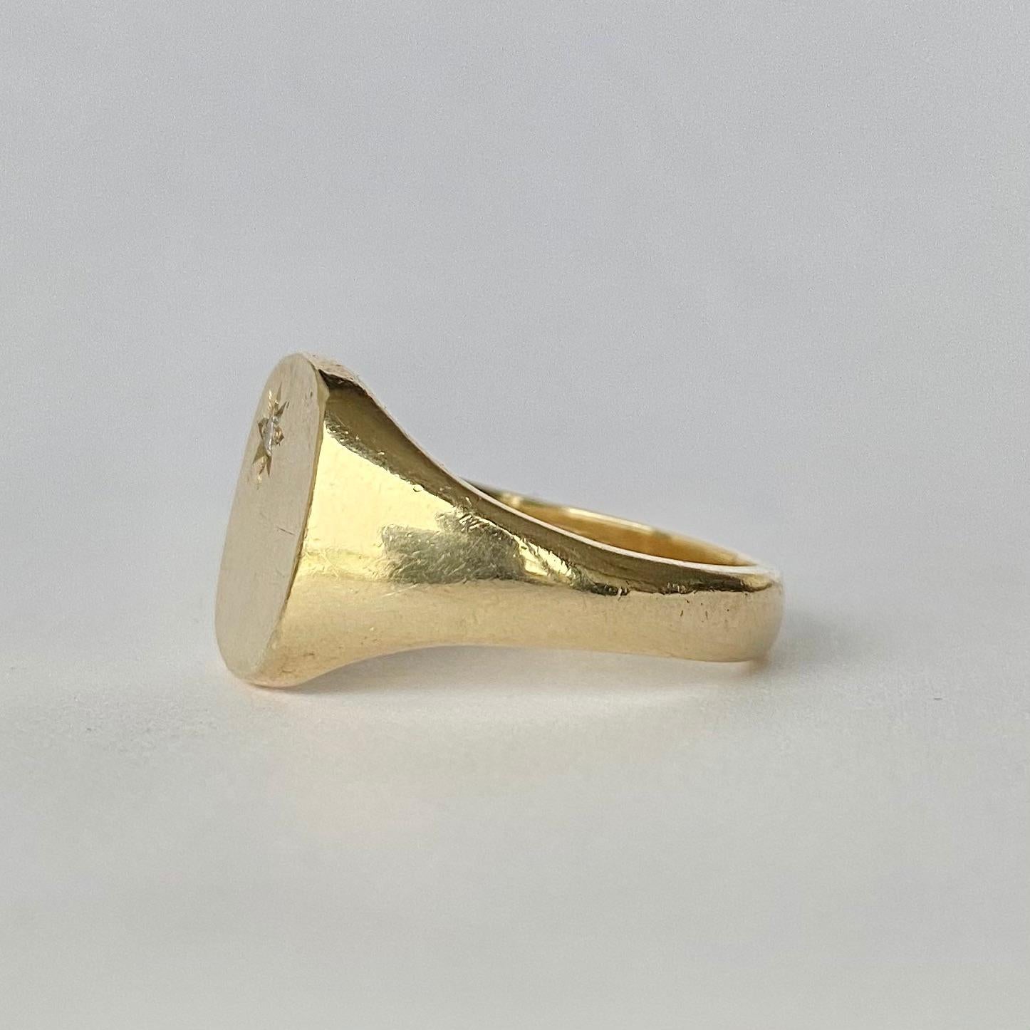 The design of this ring is fabulous! In the top corner of the main panel is a 7pt diamond set within a star setting. Fully hallmarked 1997 Birmingham, England. 

Ring Size: V 1/2 or 10 3/4 
Widest Point: 14mm 

Weight: 8g