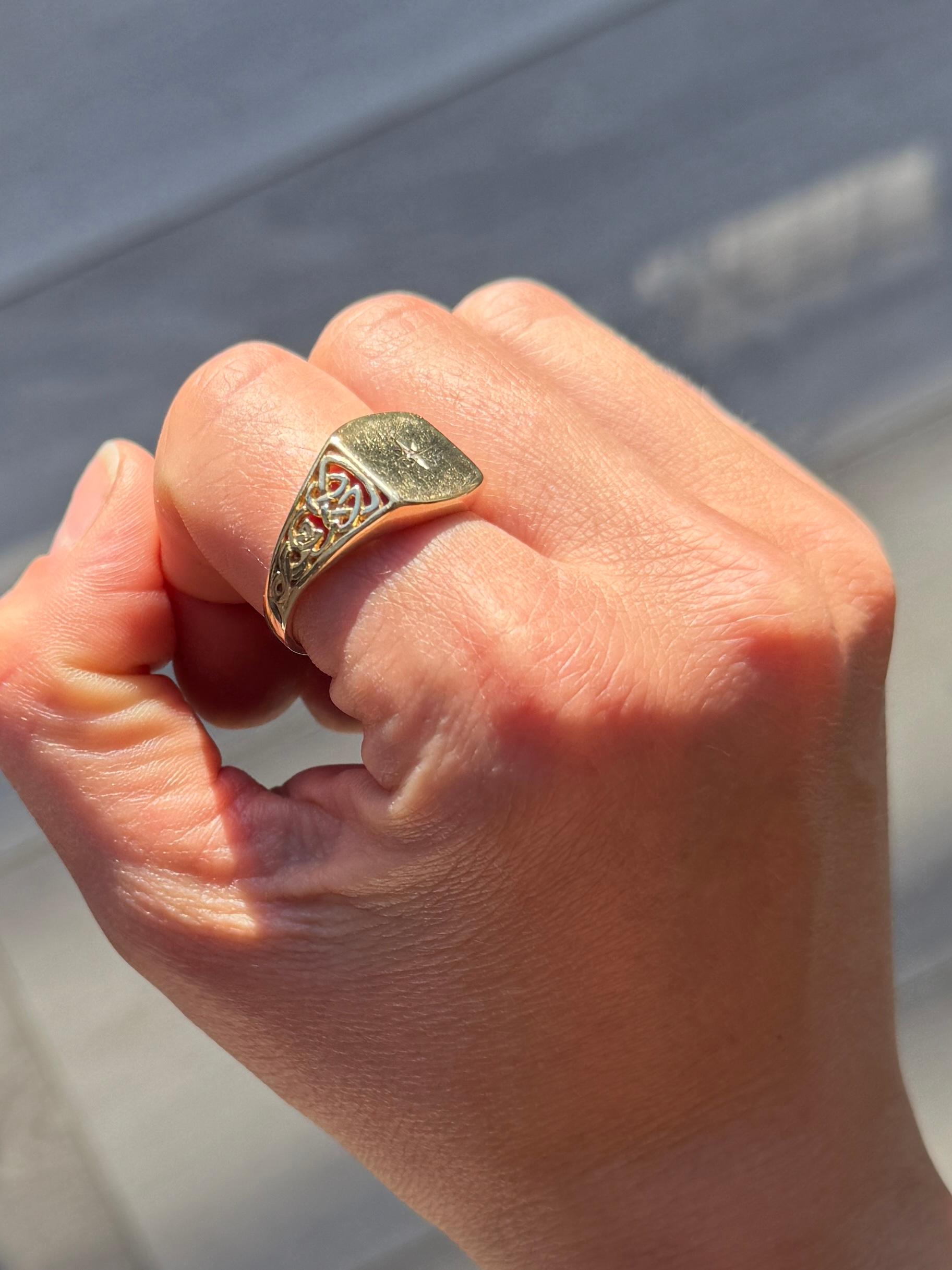 The design of this ring is fabulous! The shoulders have intricate detail to them and the face holds a 3pt diamond in a star setting. 

Ring Size: U or 10
Face Dimensions: 12x14mm 

Weight: 4.7g