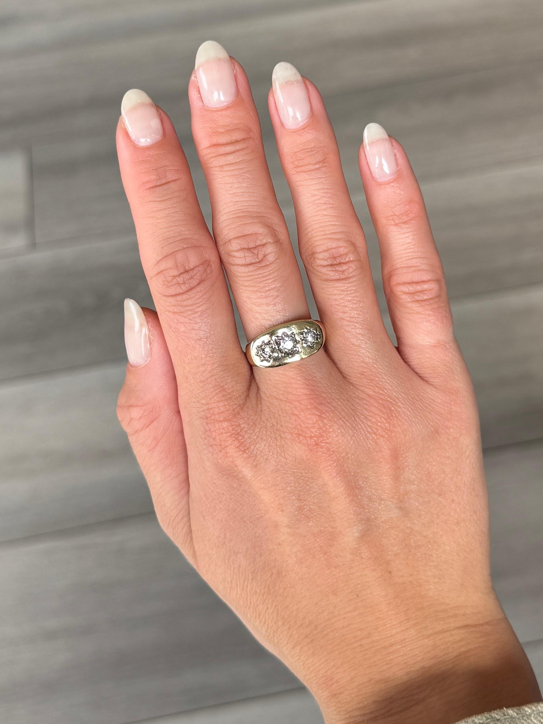 This gorgeous 9ct gold band holds three old mine cut diamonds totalling 50pts with the central stone measuring 20pts. They are bright and have a lovely sparkle and are set in star settings. Fully hallmarked Shefield 1994. 

Ring Size: O 1/2 or 7 1/2