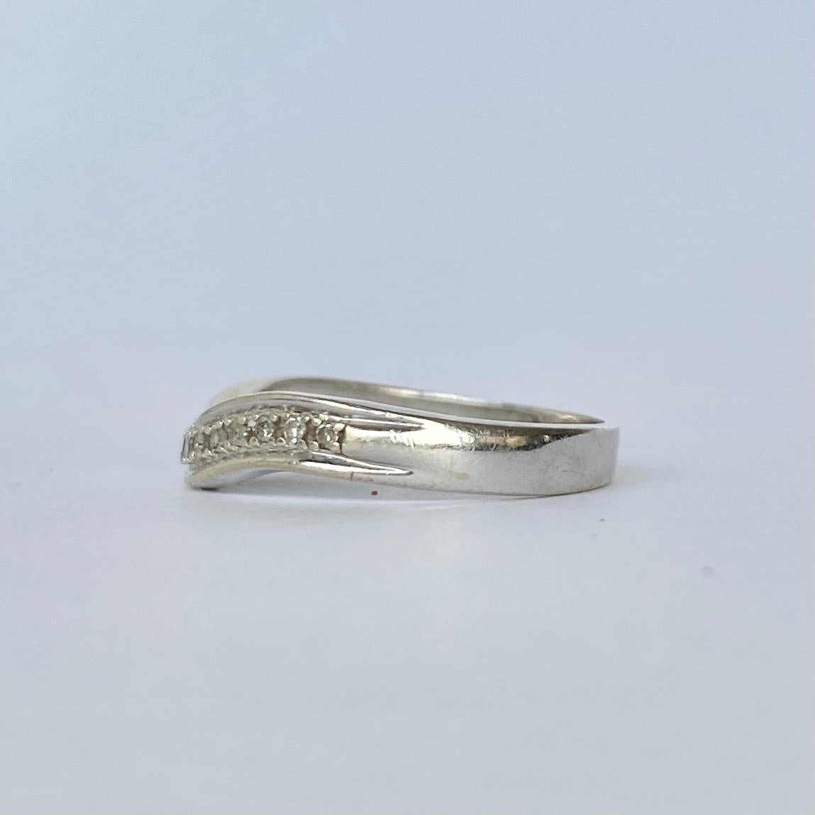 curved half eternity ring