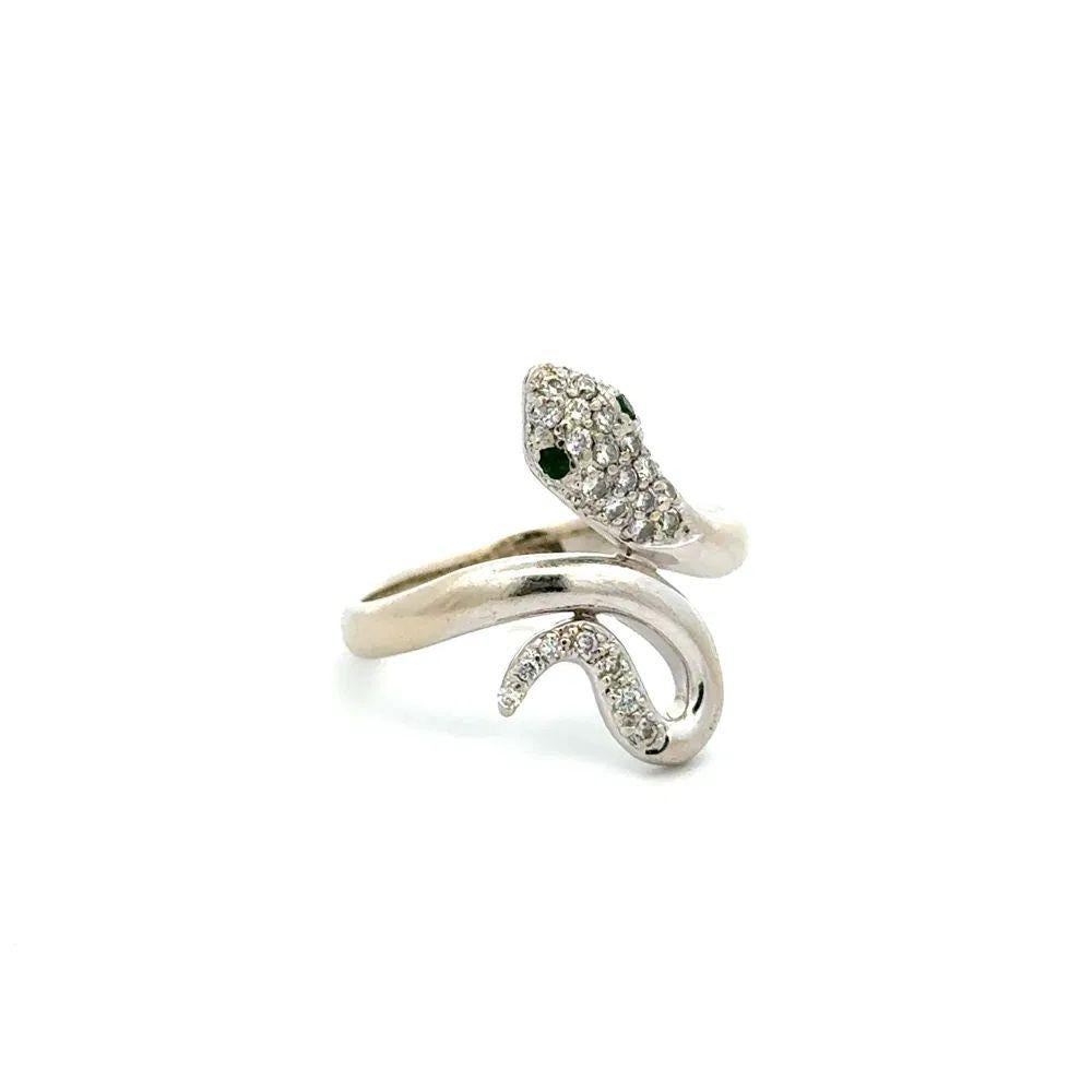 Striking Diamond Emerald Gold Serpent Snake Ring. Enhanced and Hand set with 0.25tcw Diamonds and Emerald Eyes. Hand crafted in 14K White Gold. Ring size 6.75, we offer ring re-sizing. More Beautiful in real time! This piece has a wonderful,