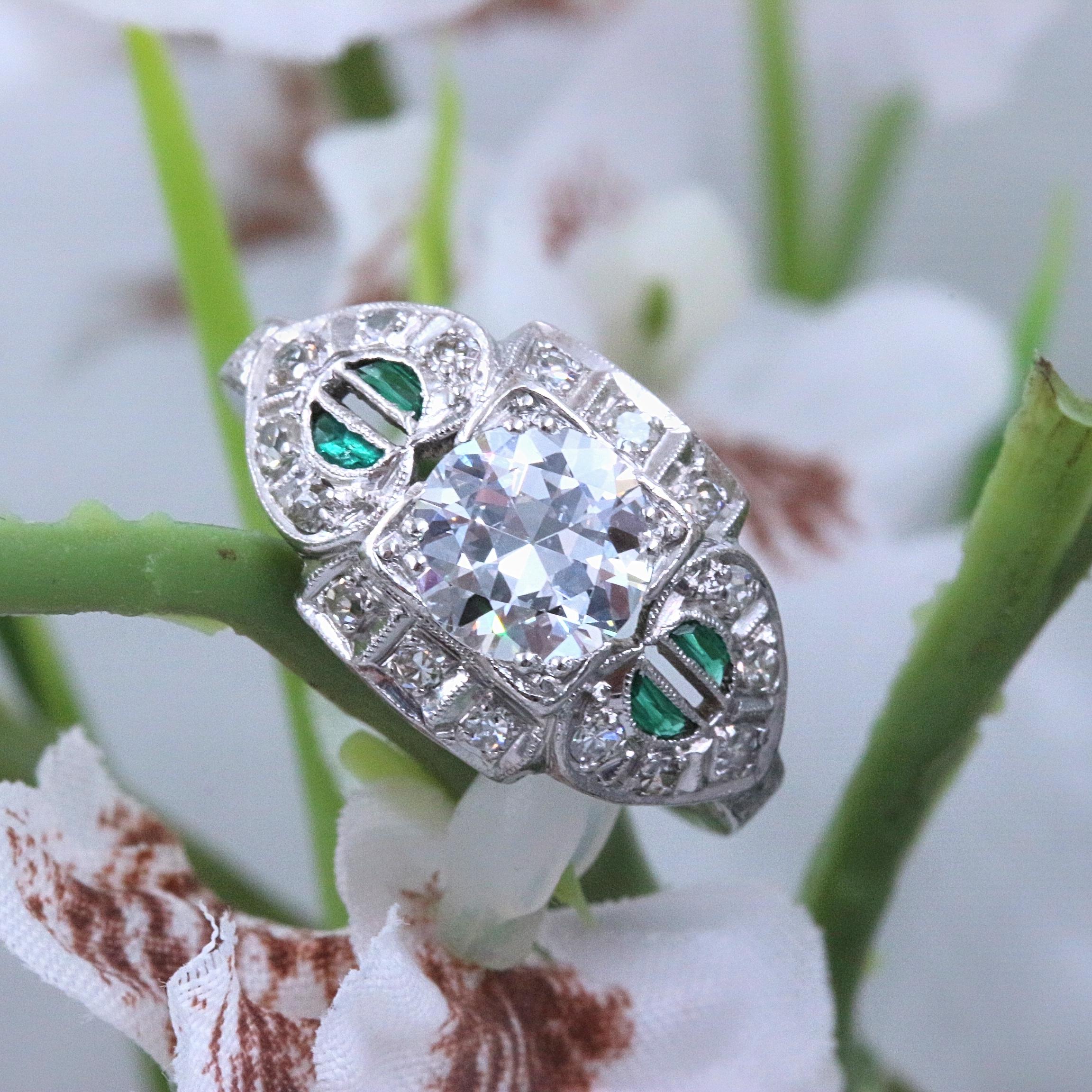 ANTIQUE EDWARDIAN DIAMONDS & EMERALDS ENGAGEMENT RING

Style:  Solitaire with Side Stones
Metal:  Platinum Head and 14k White Gold shank
Size:  6 - sizable
Total Carat Weight:  1.50 tcw
Diamond Shape:  Old Cut 0.98 cts F color, SI1 clarity
Accent