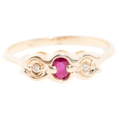 Vintage Diamond and Oval Red Ruby Three Stone Ring in 9 Carat Yellow Gold
