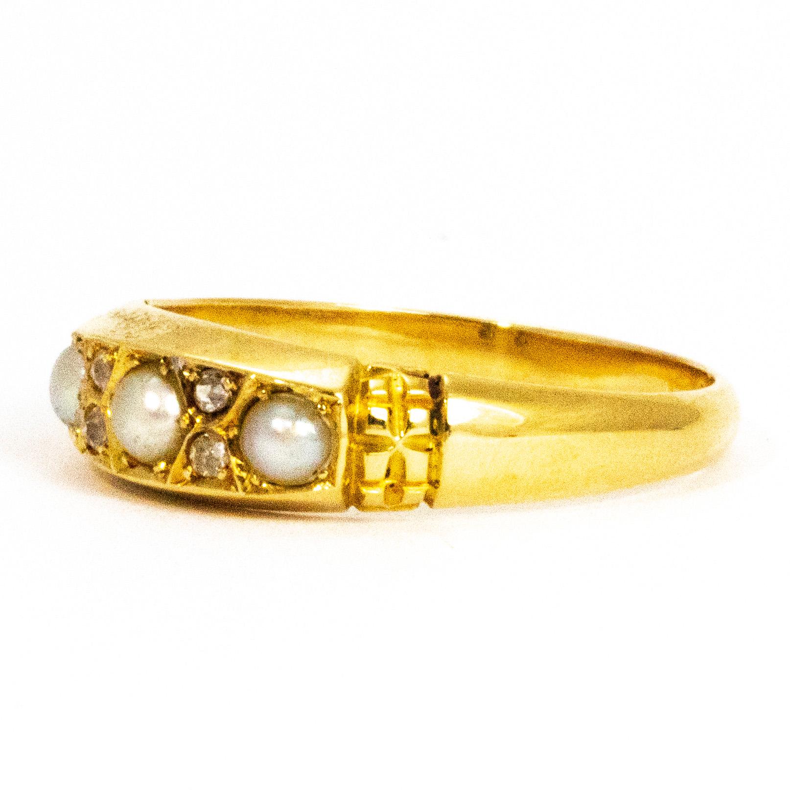 This gorgeous band holds three pearls and in between them sit a pair of double diamonds. The sheen on the pearls are beautifully complemented by the sparkling diamonds. Modelled in 18ct gold.

Ring Size: S or 9
Band Width: 6mm