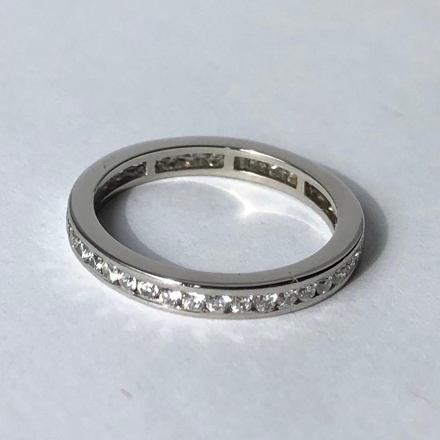This eternity band holds small yet sparkly diamonds measuring approximately 2pts each. The diamonds are set within the platinum band. 

Ring Size: I or 4 1/4 
Band Width: 2mm

Weight: 2.39g