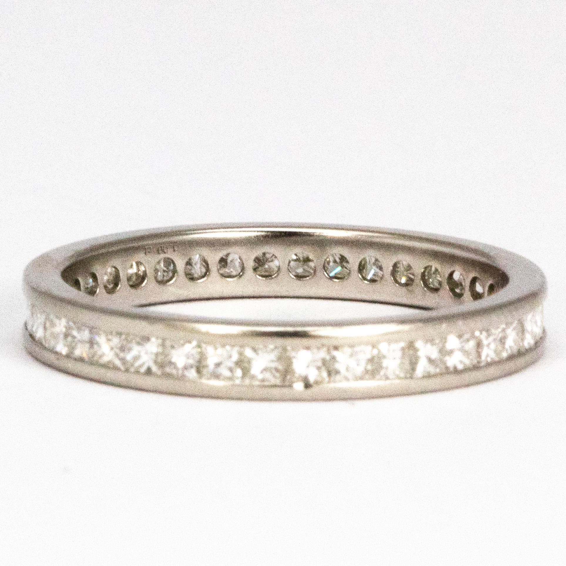 This full eternity band holds 5pt princess cut diamonds which carry on around the band. The stones sit flush in the band and this ring makes the perfect stack ring. 

Ring Size: P or 7 3/4 
Band Width: 2.7mm 