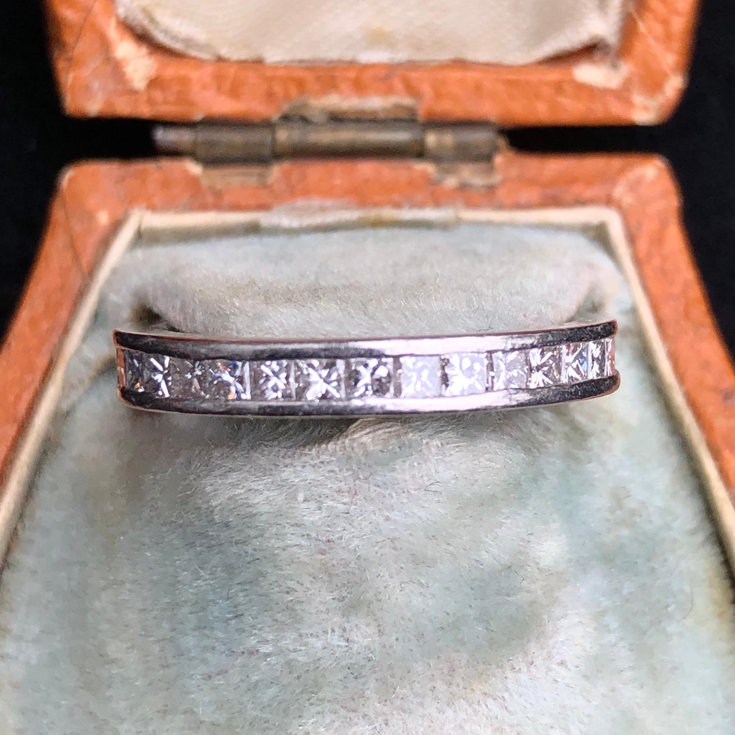 The gorgeous square cut diamonds in this eternity band are set flush in the platinum and give a smooth look to this ring. The stones reflect the light beautifully. Made in London, England. Diamond total approx 90pts.

Ring Size: I or 4 1/4

Weight: