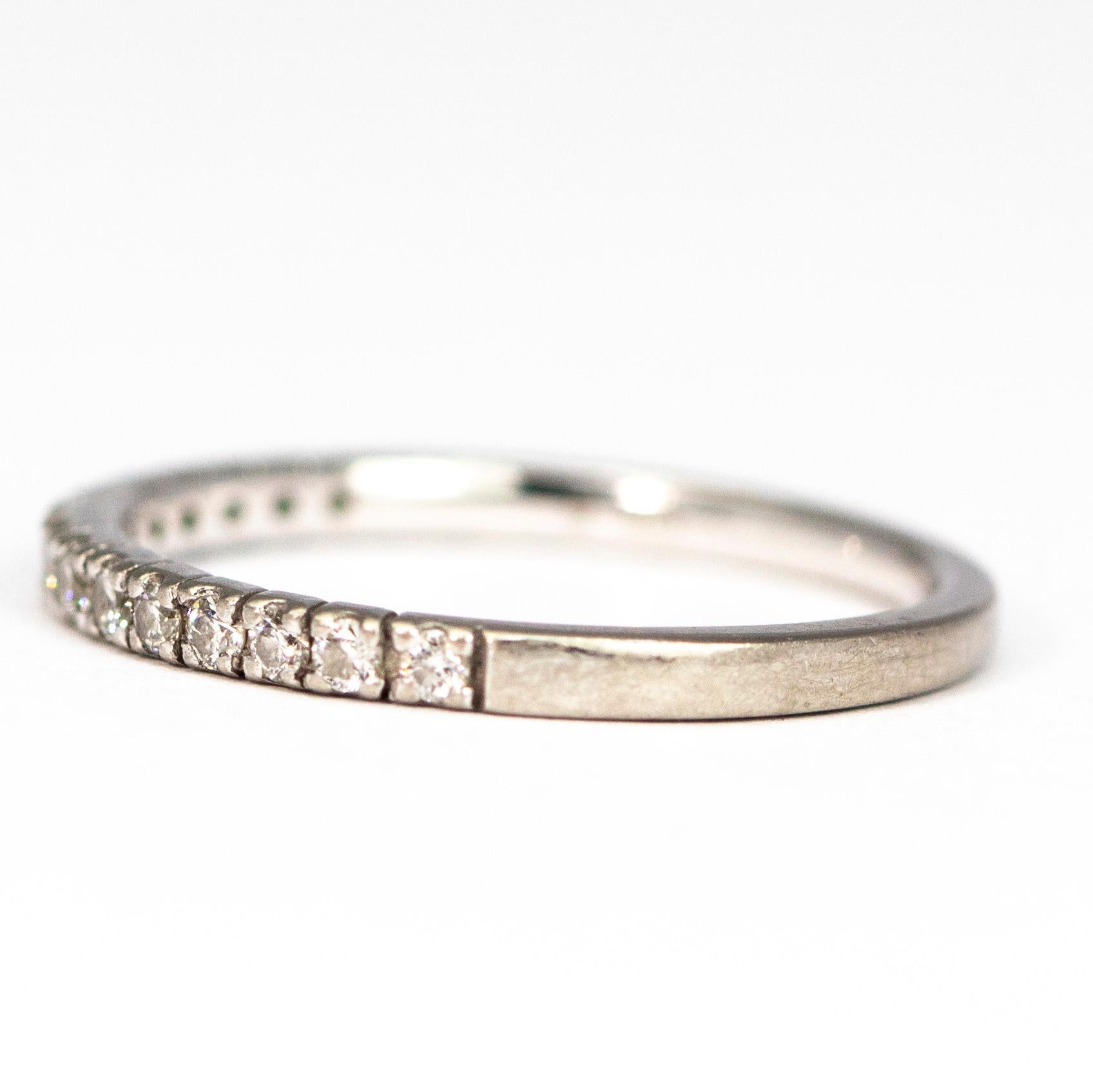 This simple half diamond band is very pretty alone or wold make the perfect stacker. The diamonds are set in platinum and each stone measures 2pts. 

Ring Size: M 1/2 or 6 1/4
Band Width: 1.5mm 

Weight: 1.5g