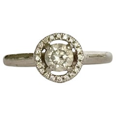 Vintage Diamond and Platinum Halo Solitaire Ring