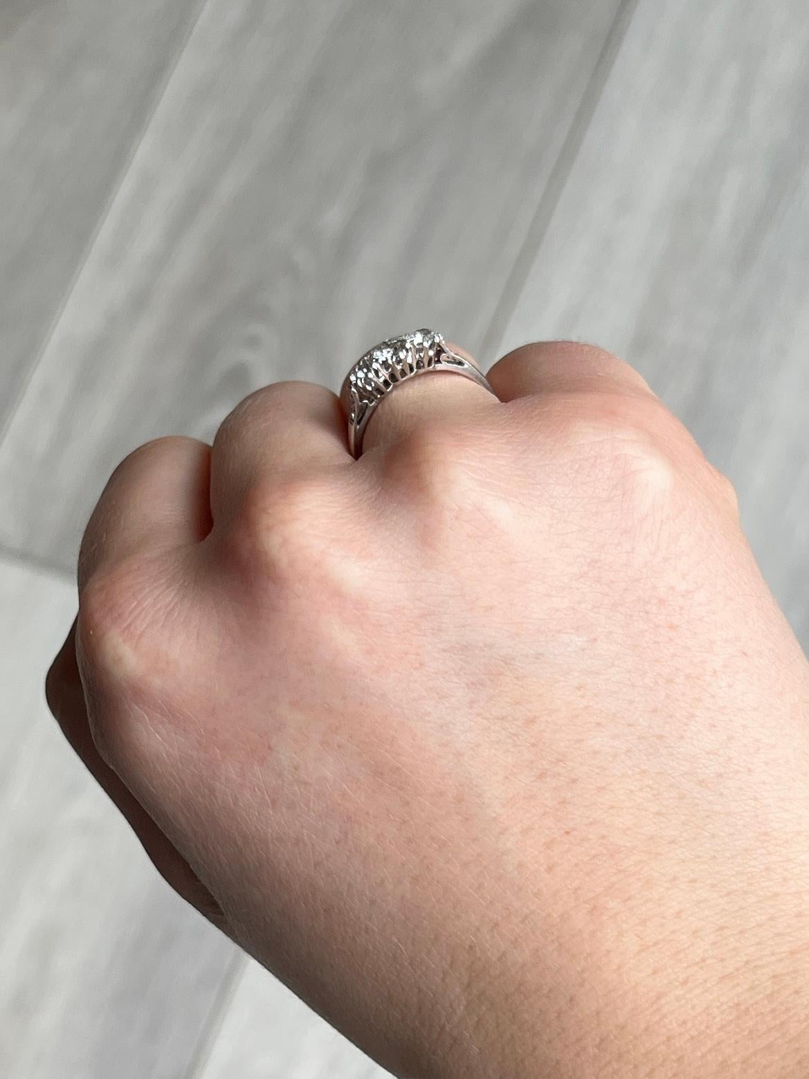 This three stone ring holds a slightly larger central diamond and two smaller ones either side. Diamond total is 85pts. Modelled in platinum.

Ring Size: M 1/2 or 6 1/2 
Height off finger: 4.5mm

Weight: 2.6g