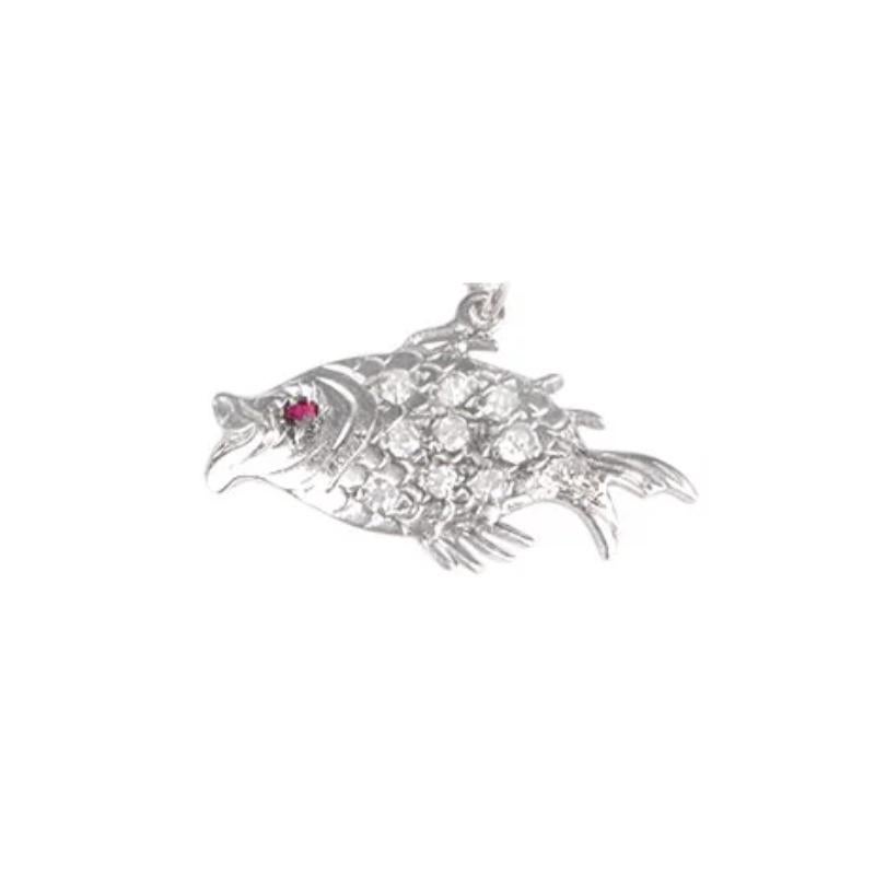 Immerse yourself in the captivating beauty of this vintage handcrafted fish charm necklace. Exuding elegance and charm, this exquisite piece features shimmering diamonds and a radiant ruby, creating a harmonious symphony of gemstones. The diamonds