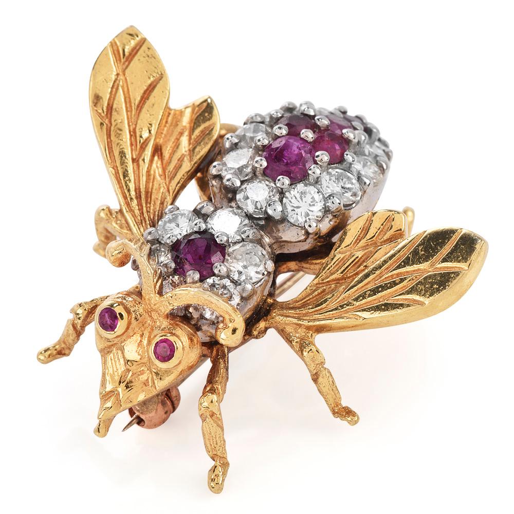 This charming 1970's vintage bee pin is crafted in 18k yellow and white gold. Body set with17 large genuine round genuine diamond weighing approx. 1.20  carats, G-H color and VS Clarity, and 9 genuine rubies including two rubies in the eyes with a