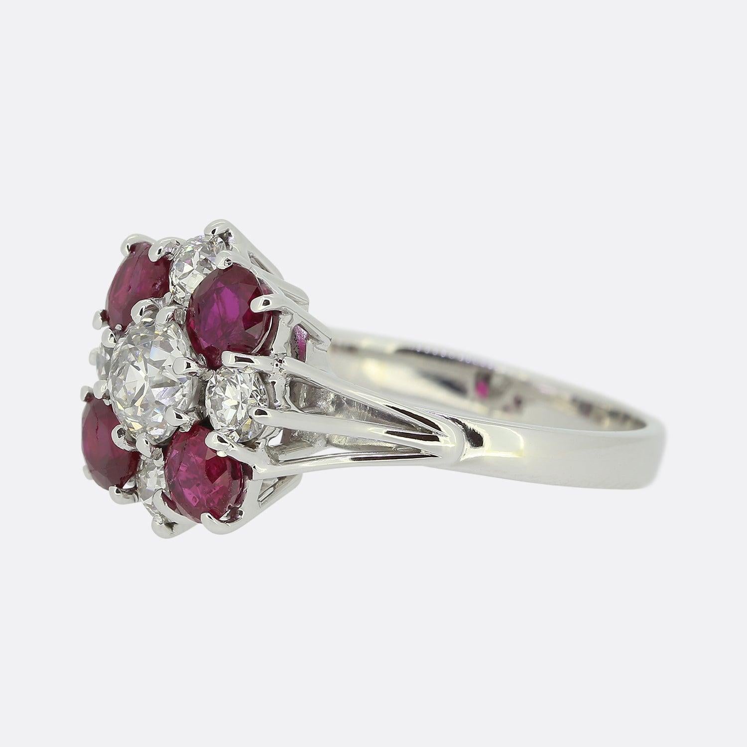 Here we have an 18ct white gold ruby and diamond cluster ring.  The diamonds are old European cuts and the centre stone is approximately 0.70 carats. The bright white old cut diamonds are highly complimented by the contrasting rich red of the four