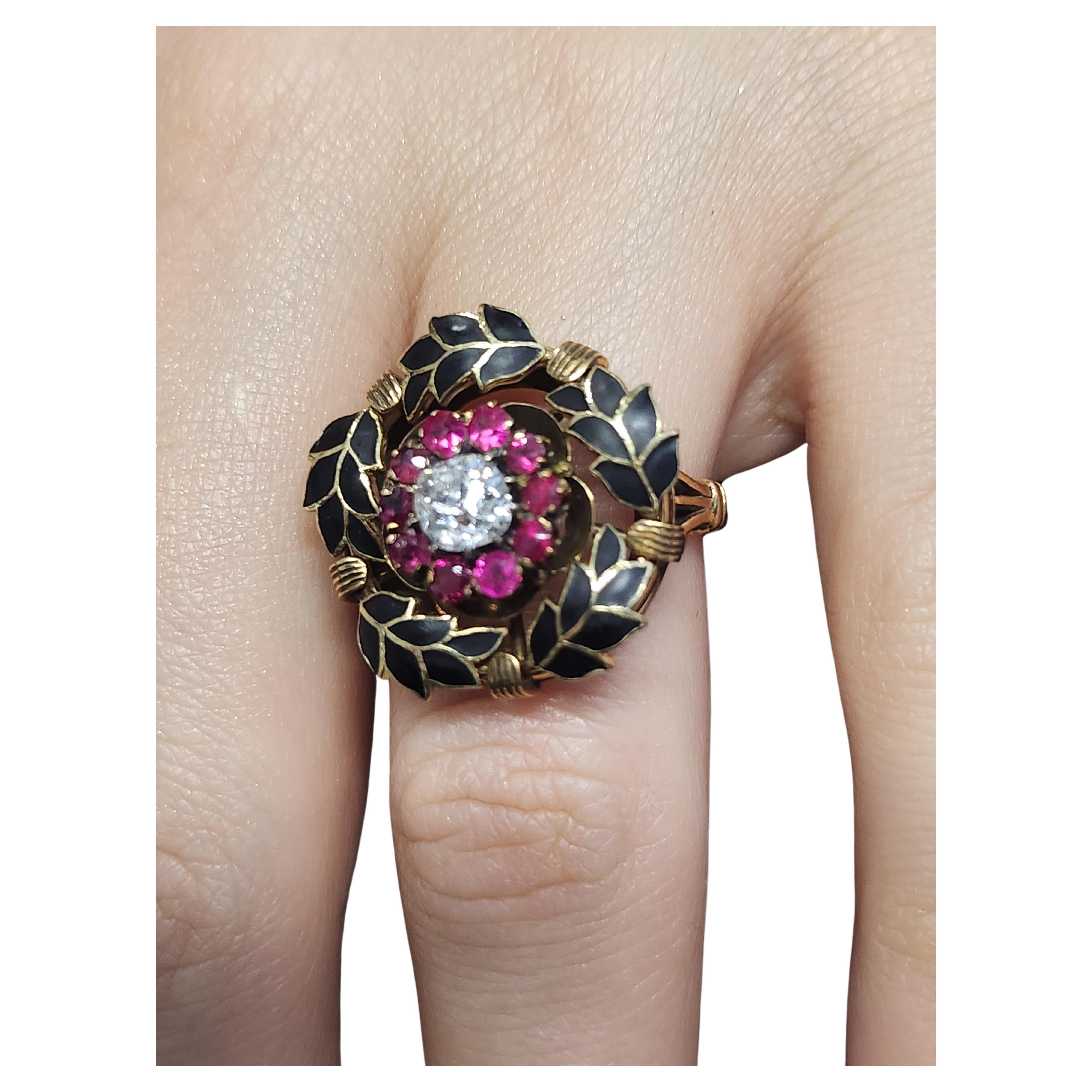 Antique 14k gold large heavy ring in black enamel olive branch ring head designe centered with old mine cut diamond estimate weight 0.50 carats H color white flanked with red ruby stones 