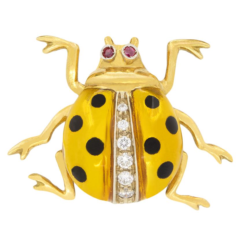 A truly unique set these Oro Griego brooches are in the shape of lady birds. Crafted from 18 carat yellow gold, each lady bird has been enamelled in a different colour, one green, one yellow and one red. In between the wings of each lady bird set a