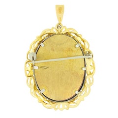 Vintage diamond and ruby portrait pendant, hallmarked 1981