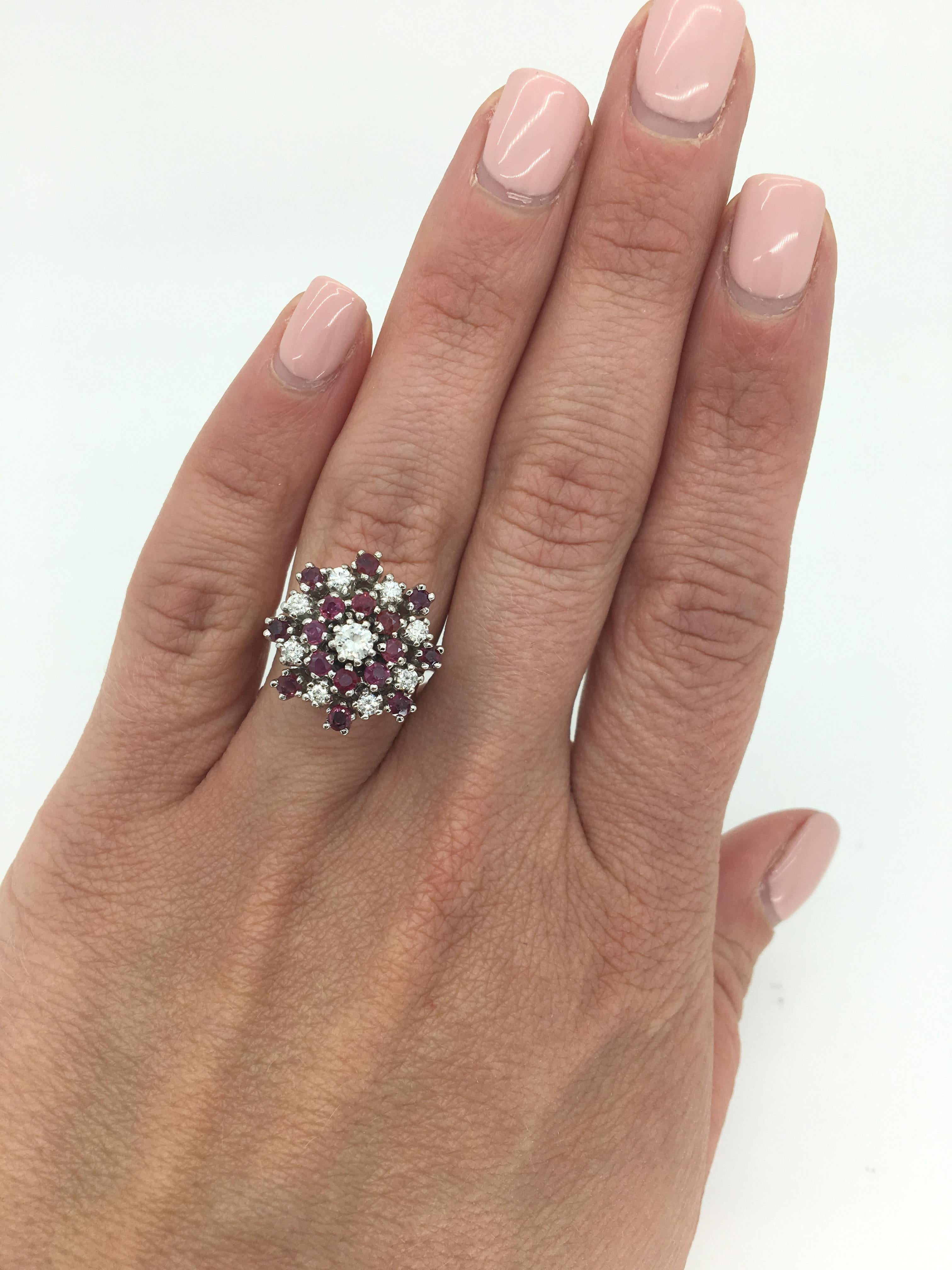 This vintage ring features approximately .50ctw of Round Brilliant cut diamonds and 16 beautiful Round Cut Rubies set in 14K white gold.

Gemstone: Ruby & Diamond
Diamond Carat Weight: Approximately .50CTW
Diamond Cut: 9 Round Brilliant Cut
Color: