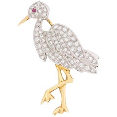 Broche vintage de diamantes y rubíes con forma de cigüeña, circa años 50