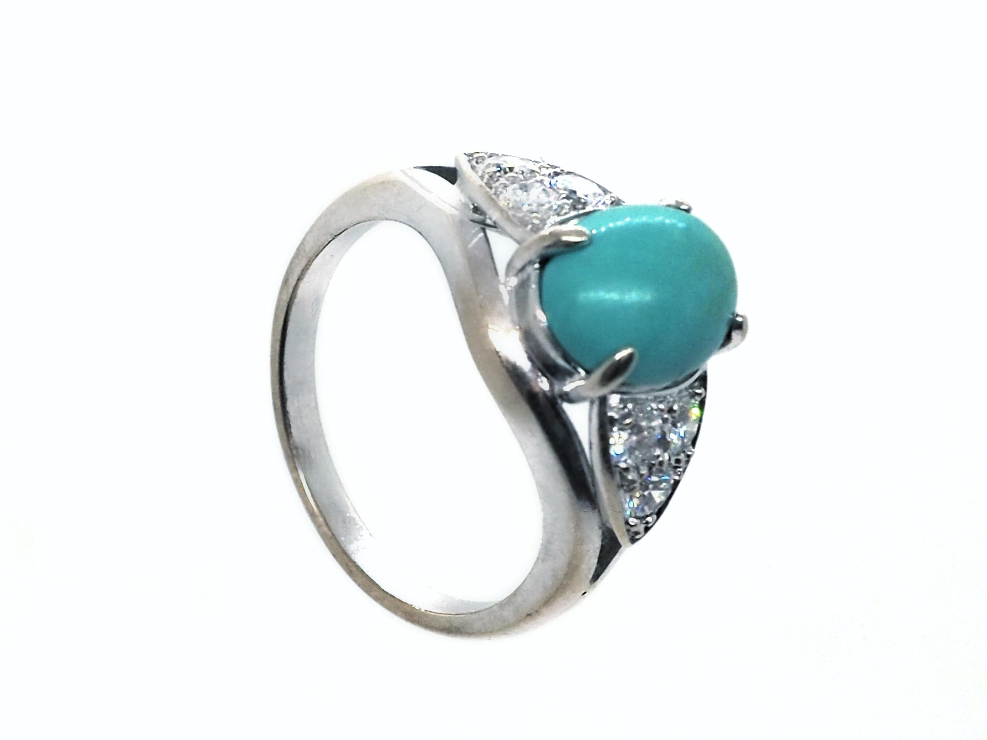 Diamond and turquoise ring crafted in 18K white gold. The ring features  an oval turquoise cabochon and 6 brilliant-cut round diamonds with an approximate weight of 0.8 carat.

Total weight: 6 grams
Eu size: 56
US size: 7.75

The ring can be resized