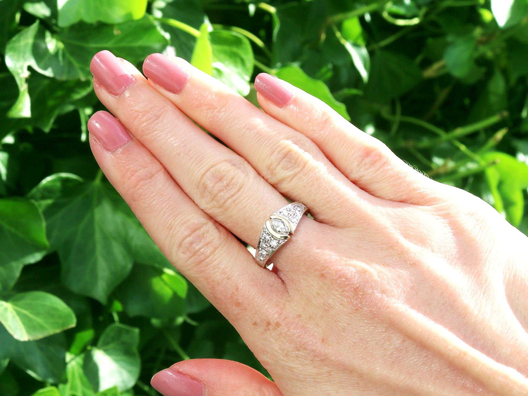 A fine and impressive vintage 0.72 carat diamond, 14 karat white gold and 14 karat yellow gold set dress ring; part of our diverse vintage jewelry collections.

This fine and impressive vintage diamond ring has been crafted in 14k white gold with a