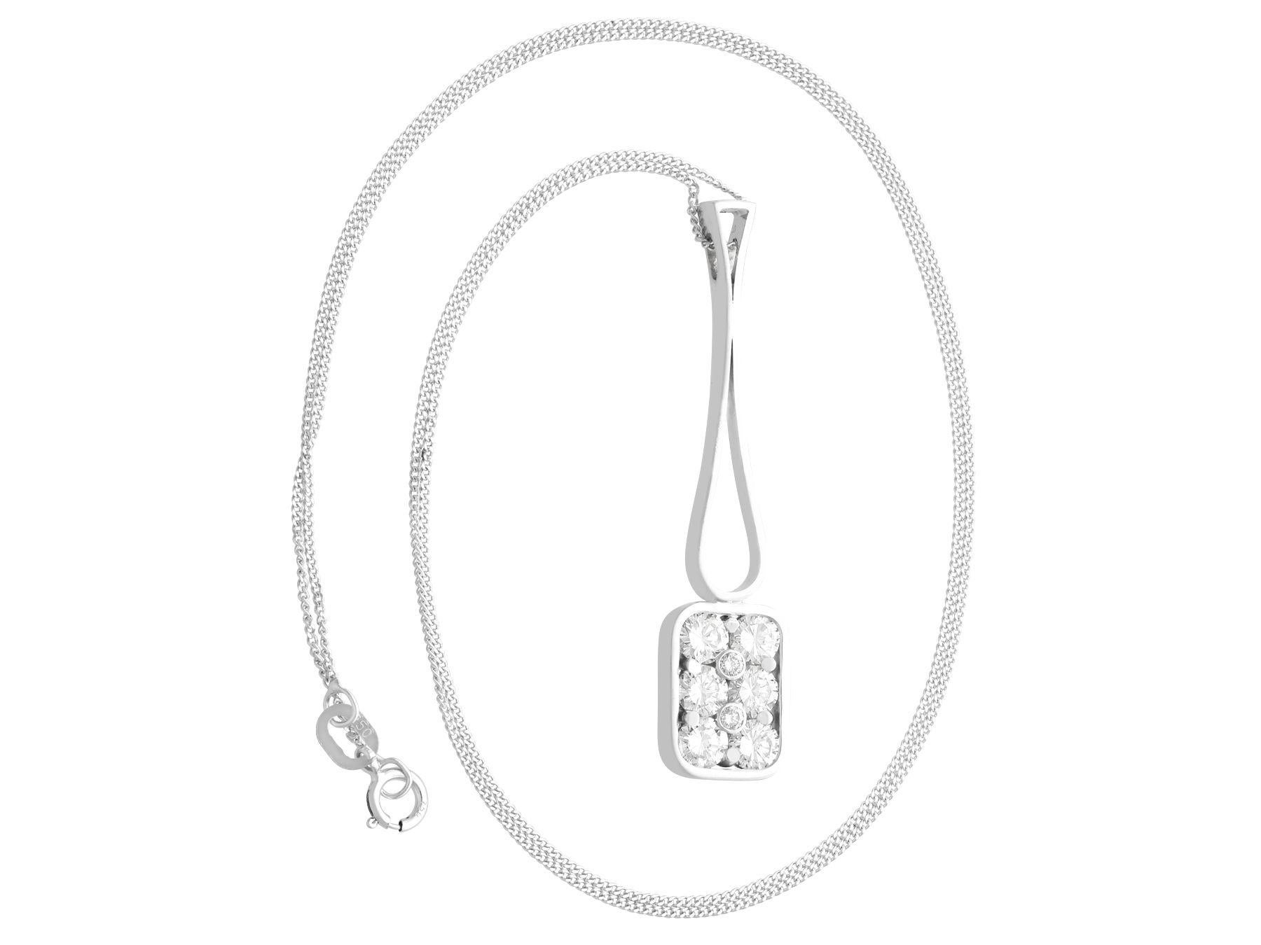 A fine and impressive vintage 0.96 carat diamond and 18 karat white gold pendant; part of our diverse diamond jewelry and estate jewelry collections.

This fine and impressive vintage multi-diamond pendant has been crafted in 18k white gold.

The