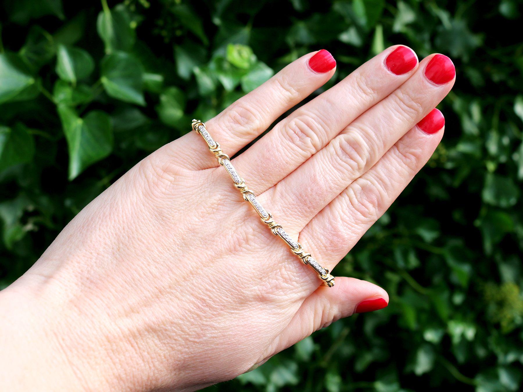 A fine and impressive 0.85 carat and 18 karat yellow gold bracelet; part of our diverse vintage jewelry and estate jewelry collections.

This fine and impressive vintage diamond bracelet has been crafted in 18k yellow gold with 18k white gold