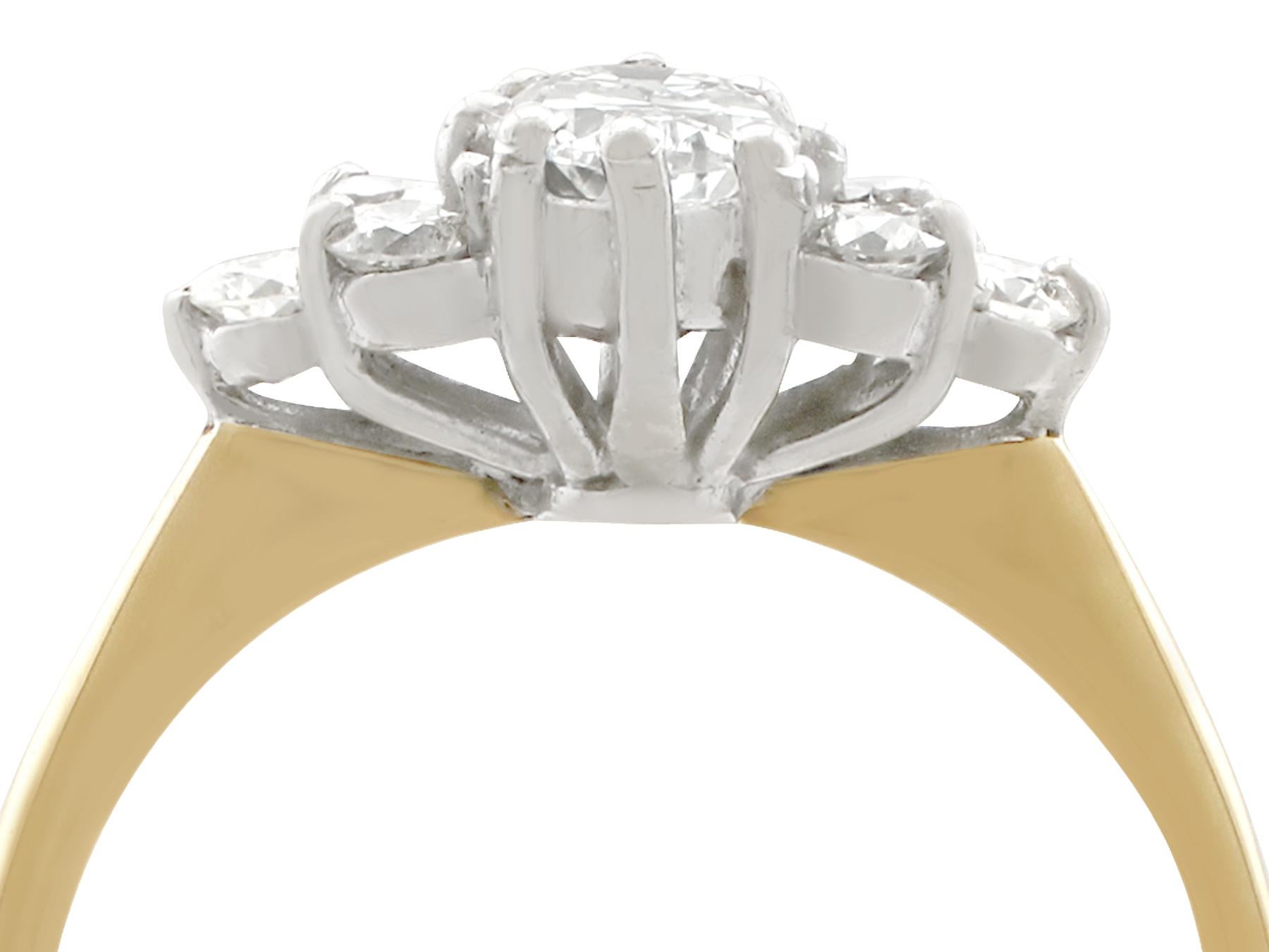 A fine and impressive vintage 0.98 carat diamond and 18 karat yellow gold and 18 karat white gold cocktail ring; part of our diverse vintage jewelry and estate jewelry collections.

This fine and impressive vintage diamond cluster ring has been